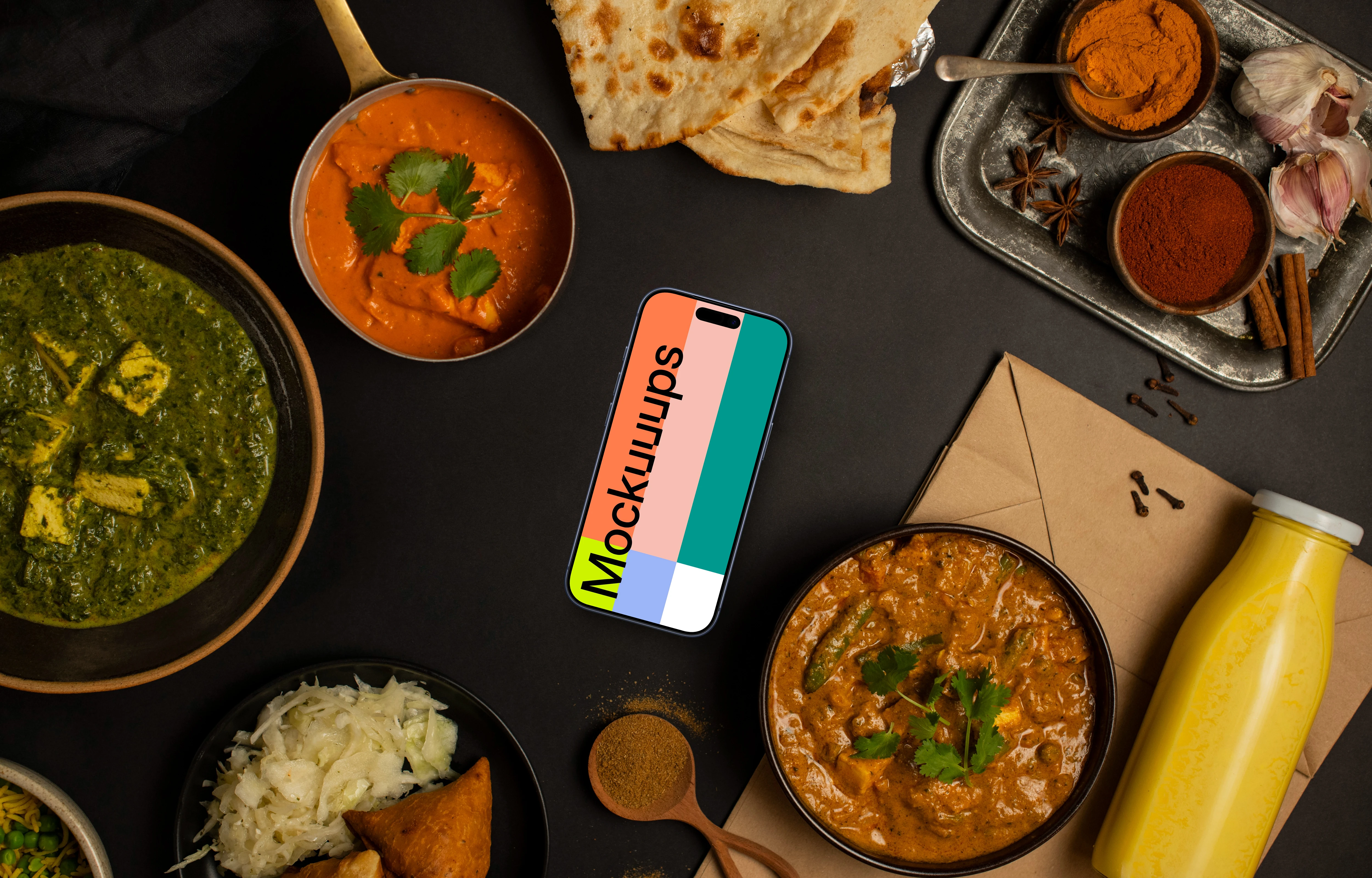 Smartphone mockup surrounded by Indian food