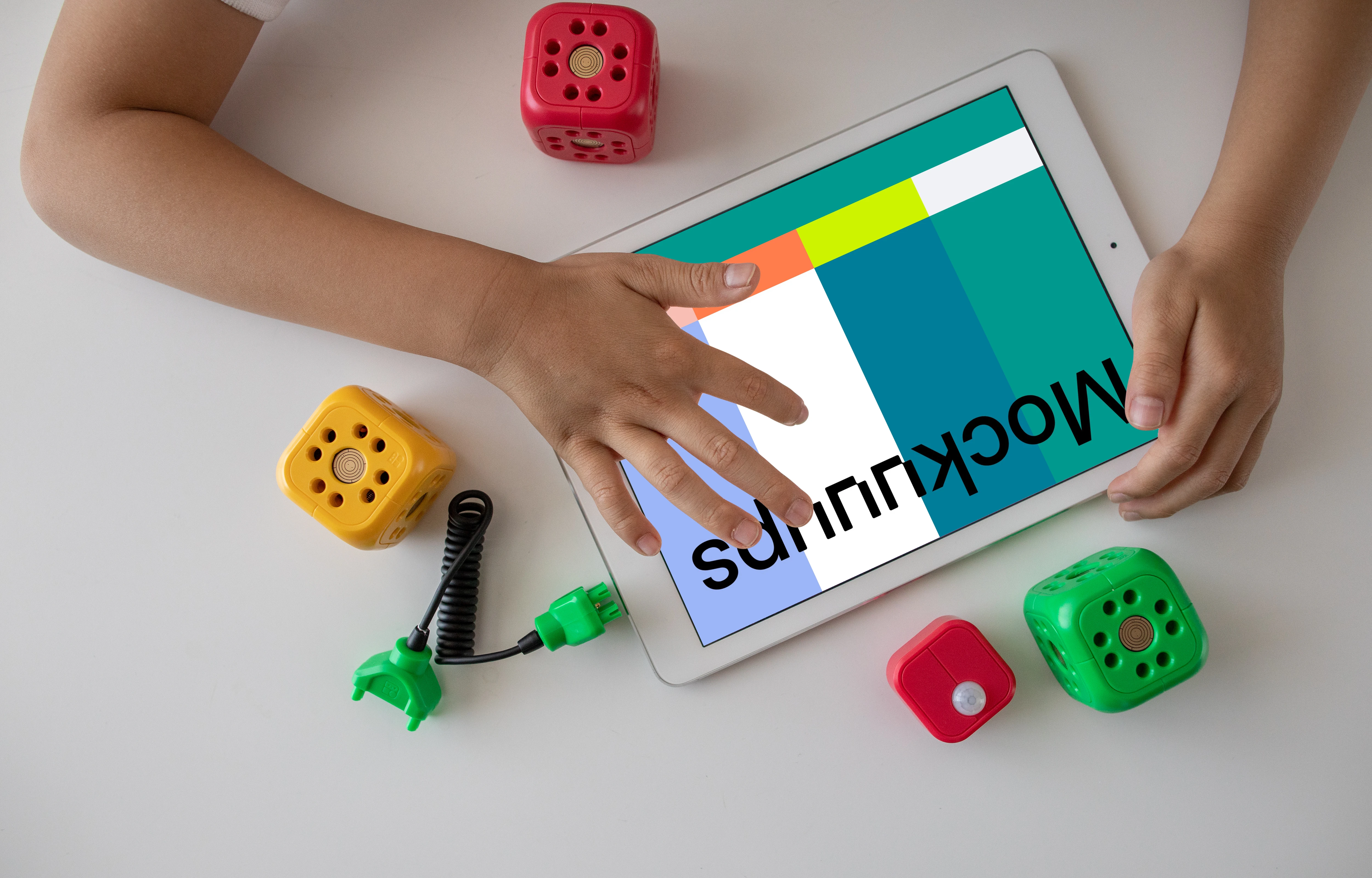 Child playing a game on an iPad mockup