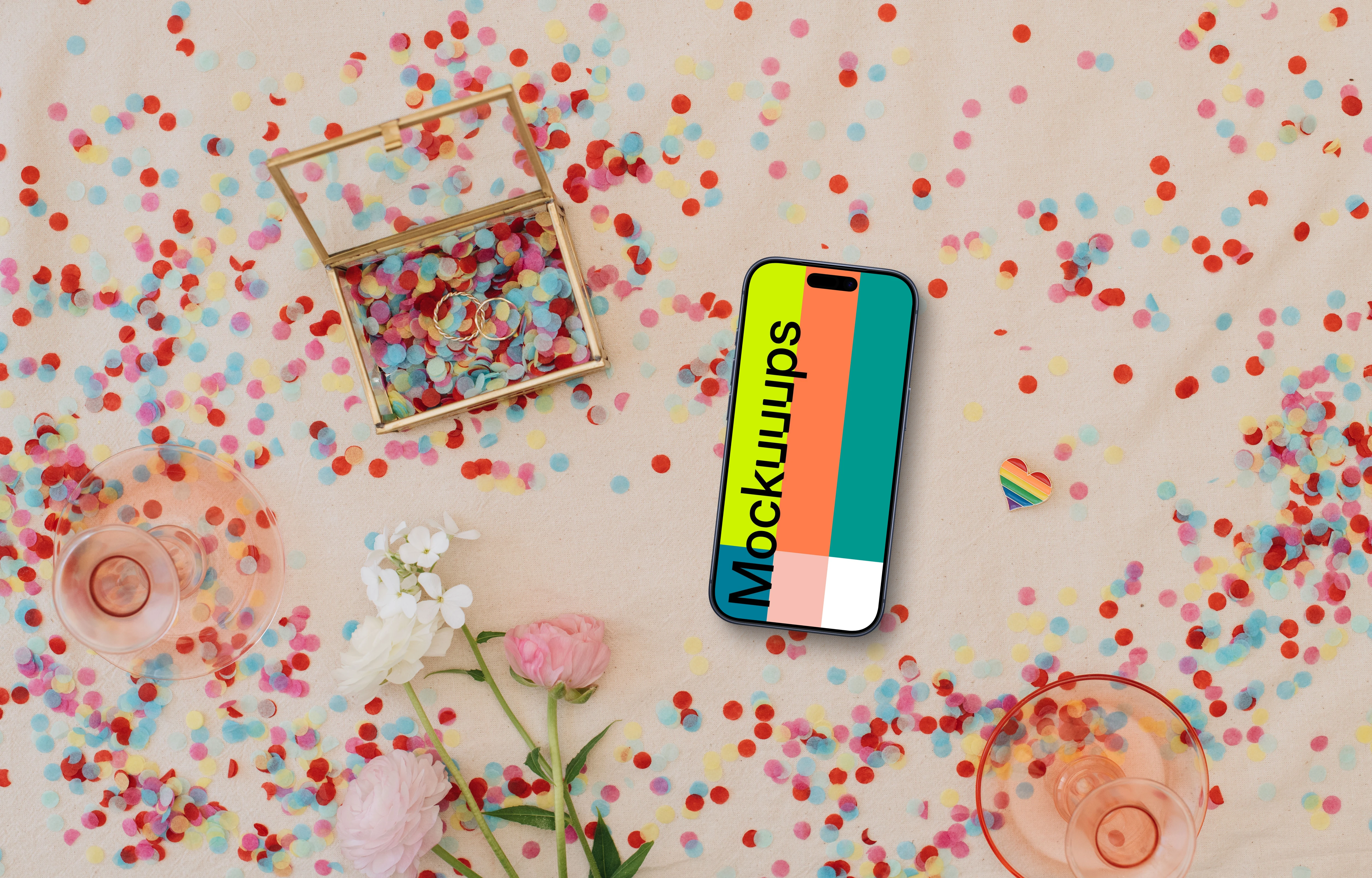 Confetti and wedding rings around iPhone mockup