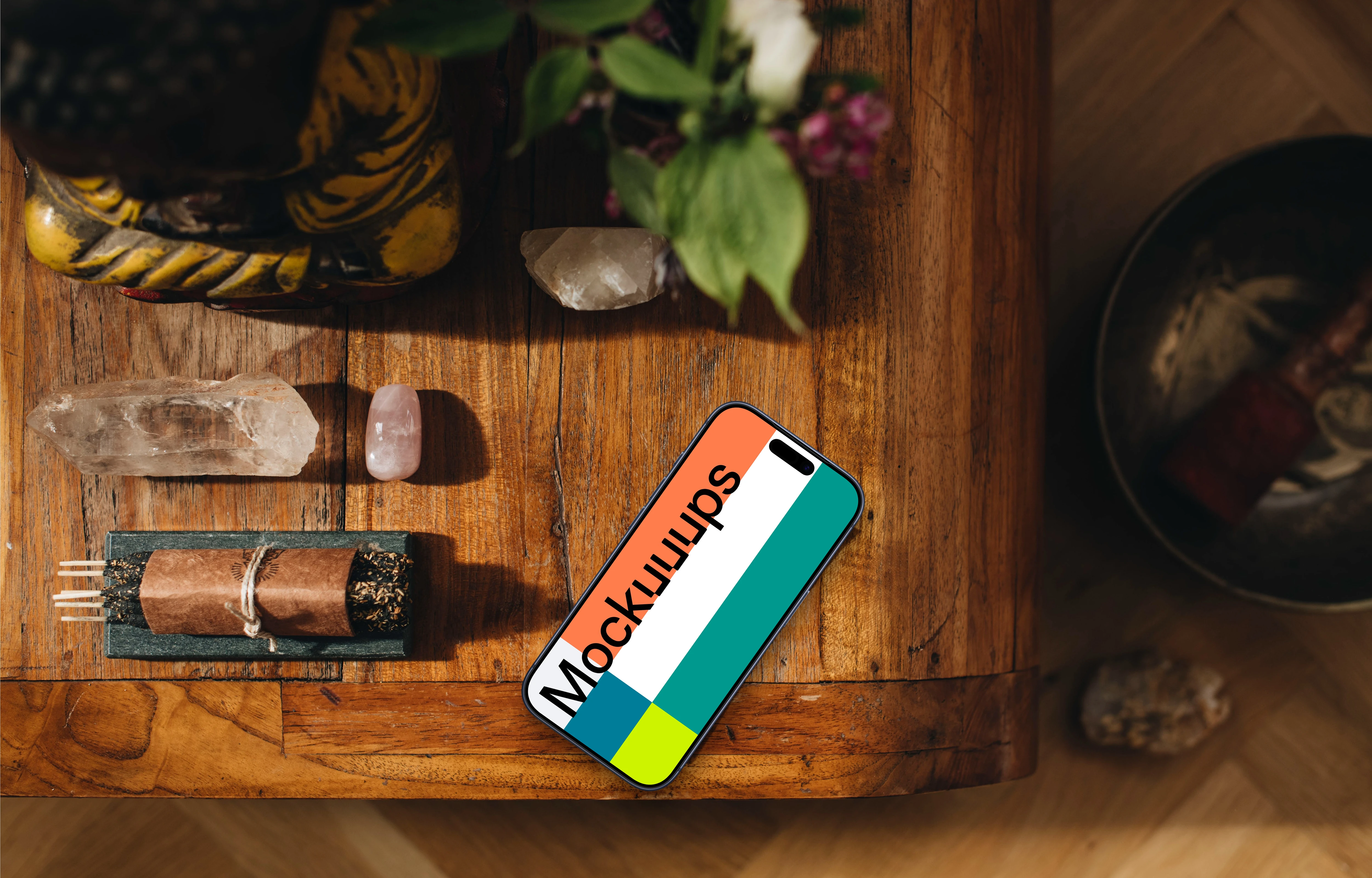 Crystals and minerals next to the iPhone mockup