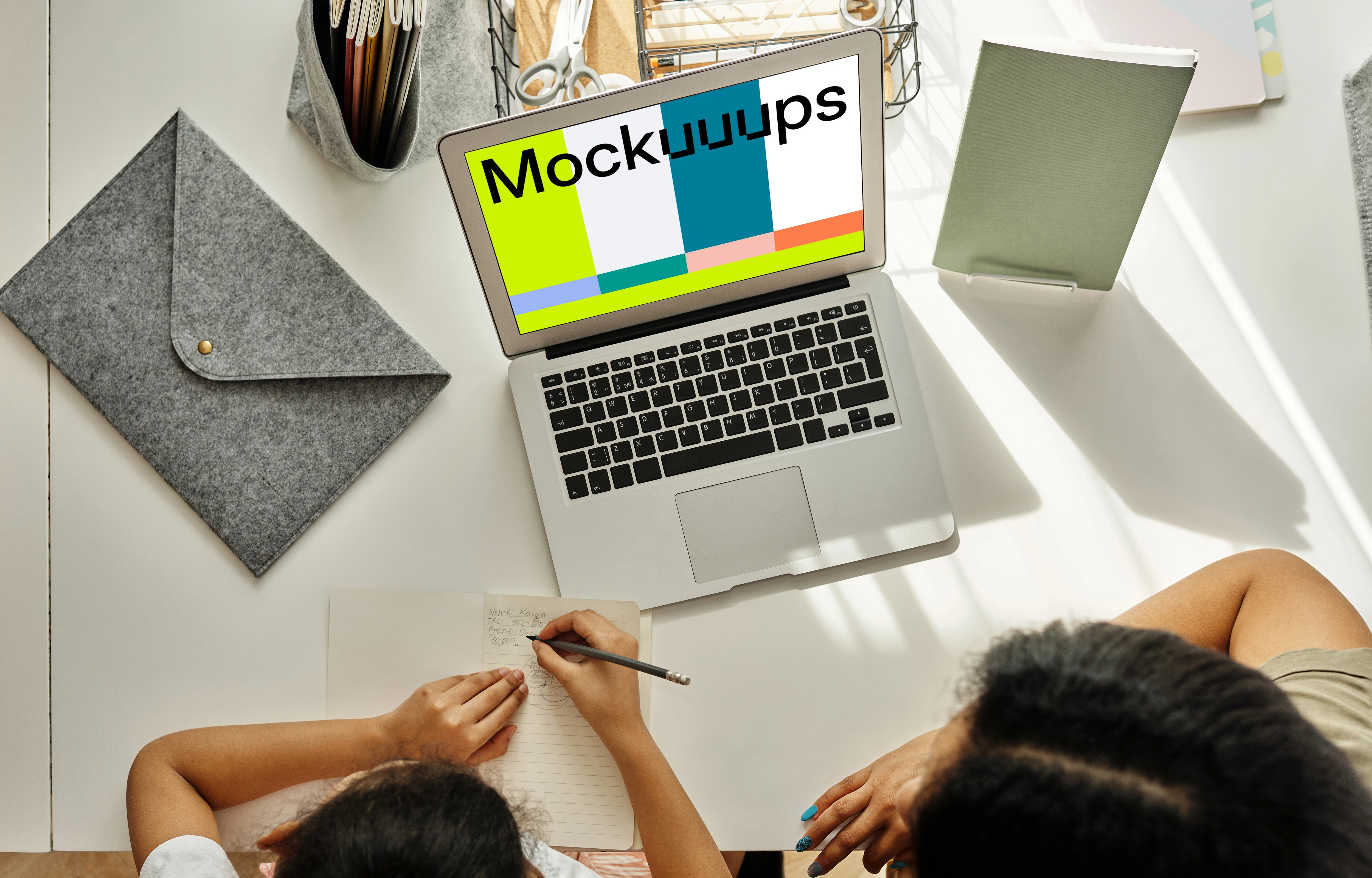 Mockup of adult teaching a kid using a MacBook Air
