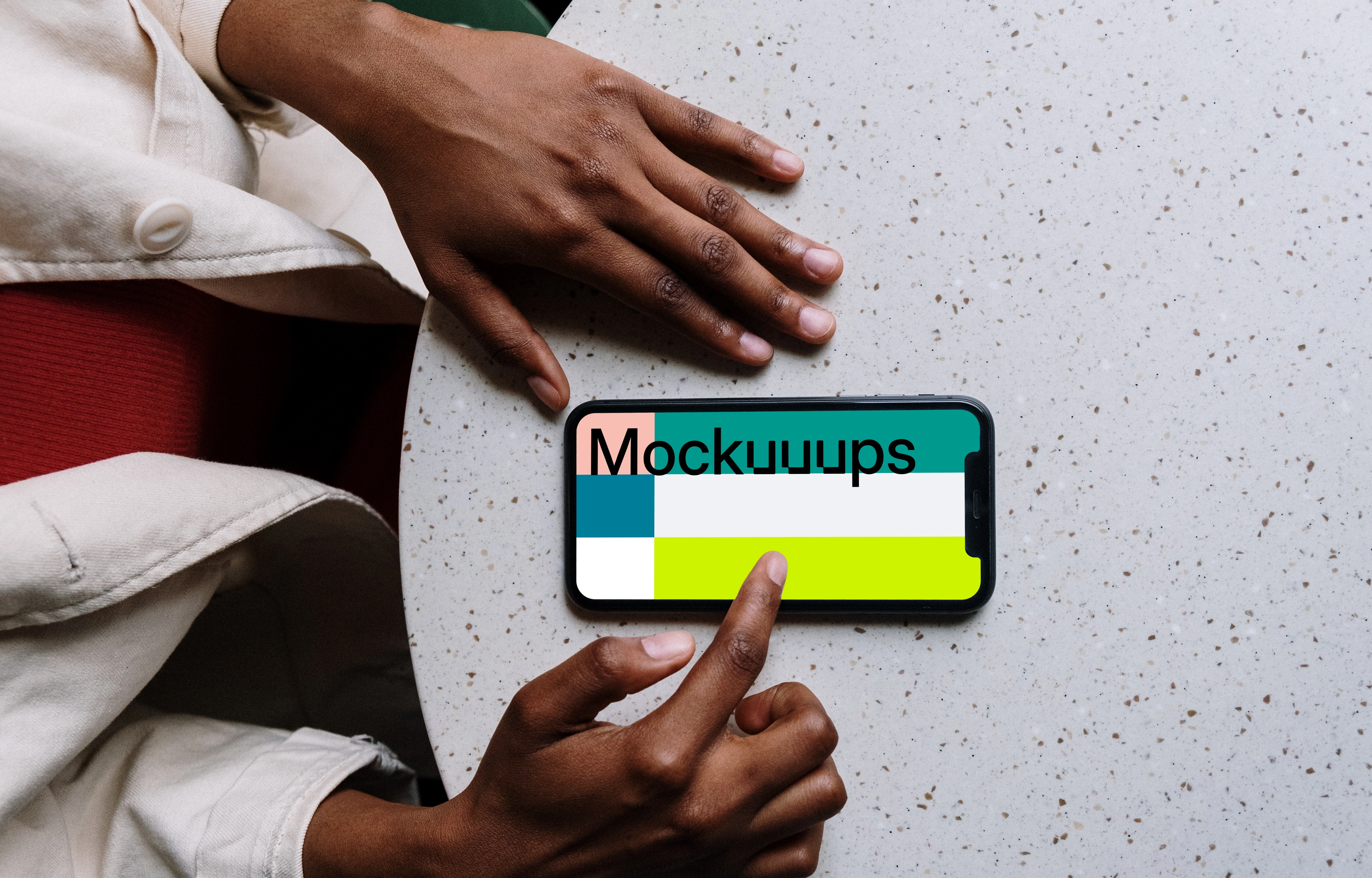 iPhone mockup on white table