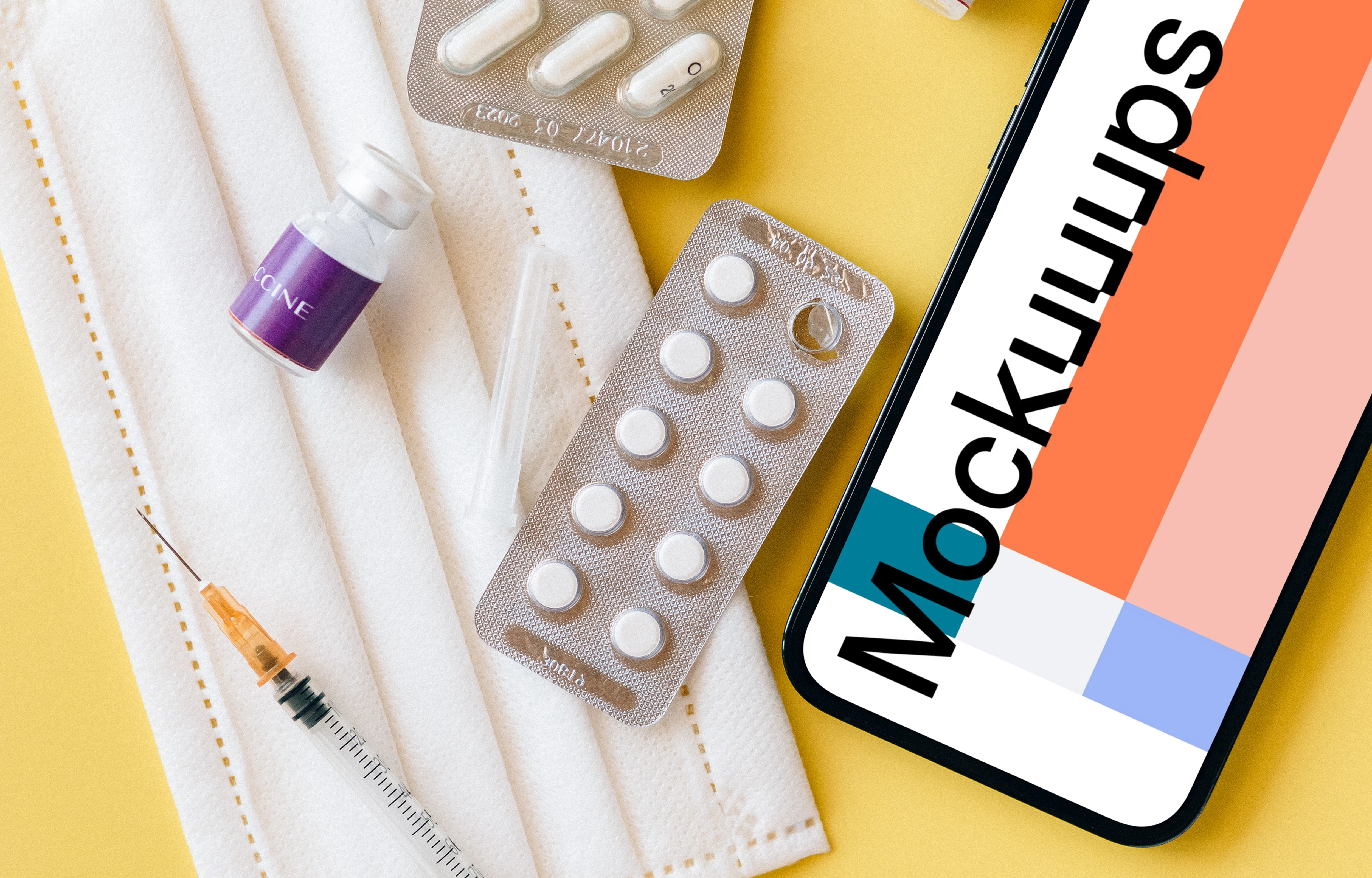 iPhone 12 Pro mockup on a table beside some medicines