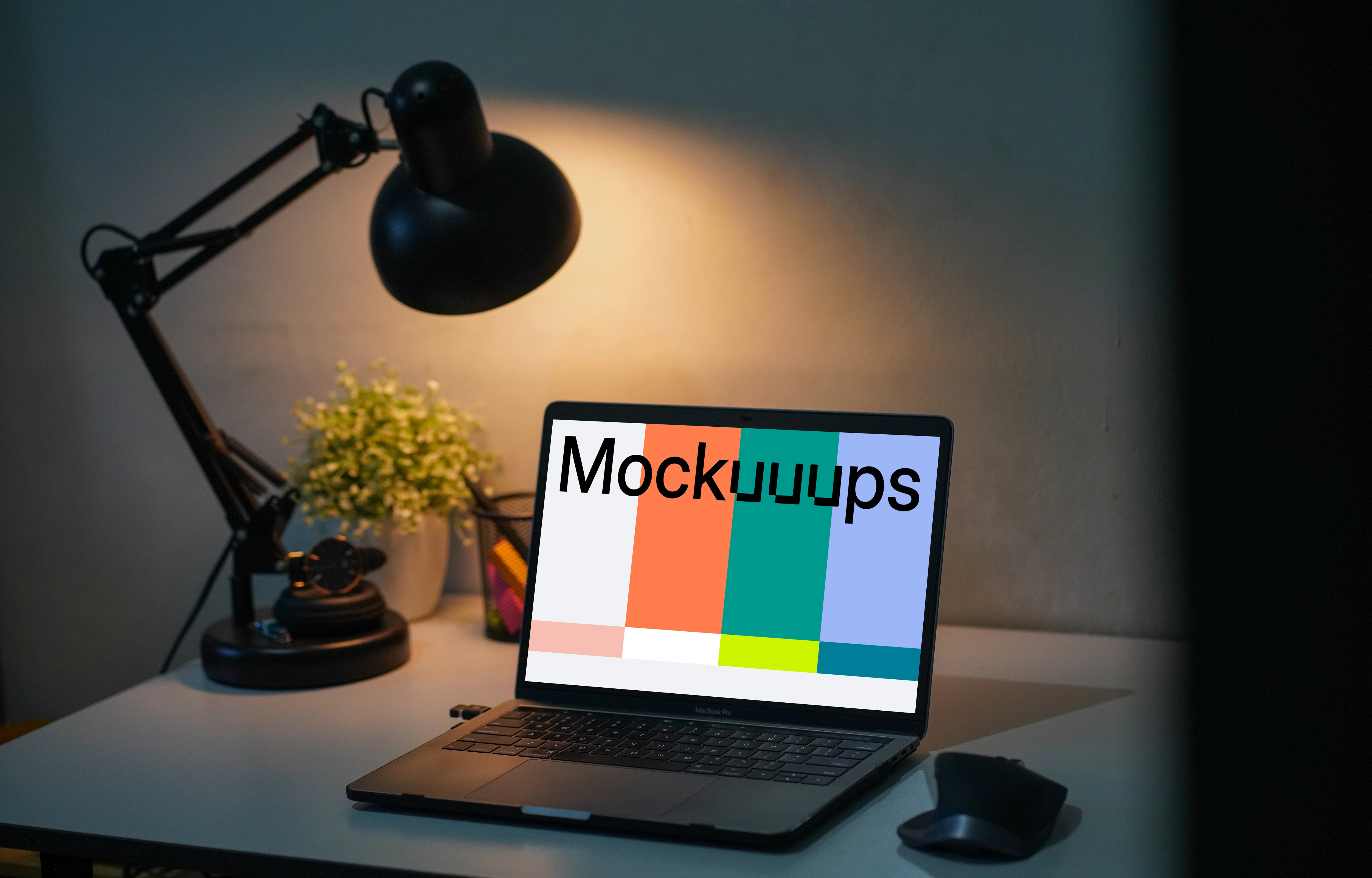 MacBook Pro mockup on a table with reading light