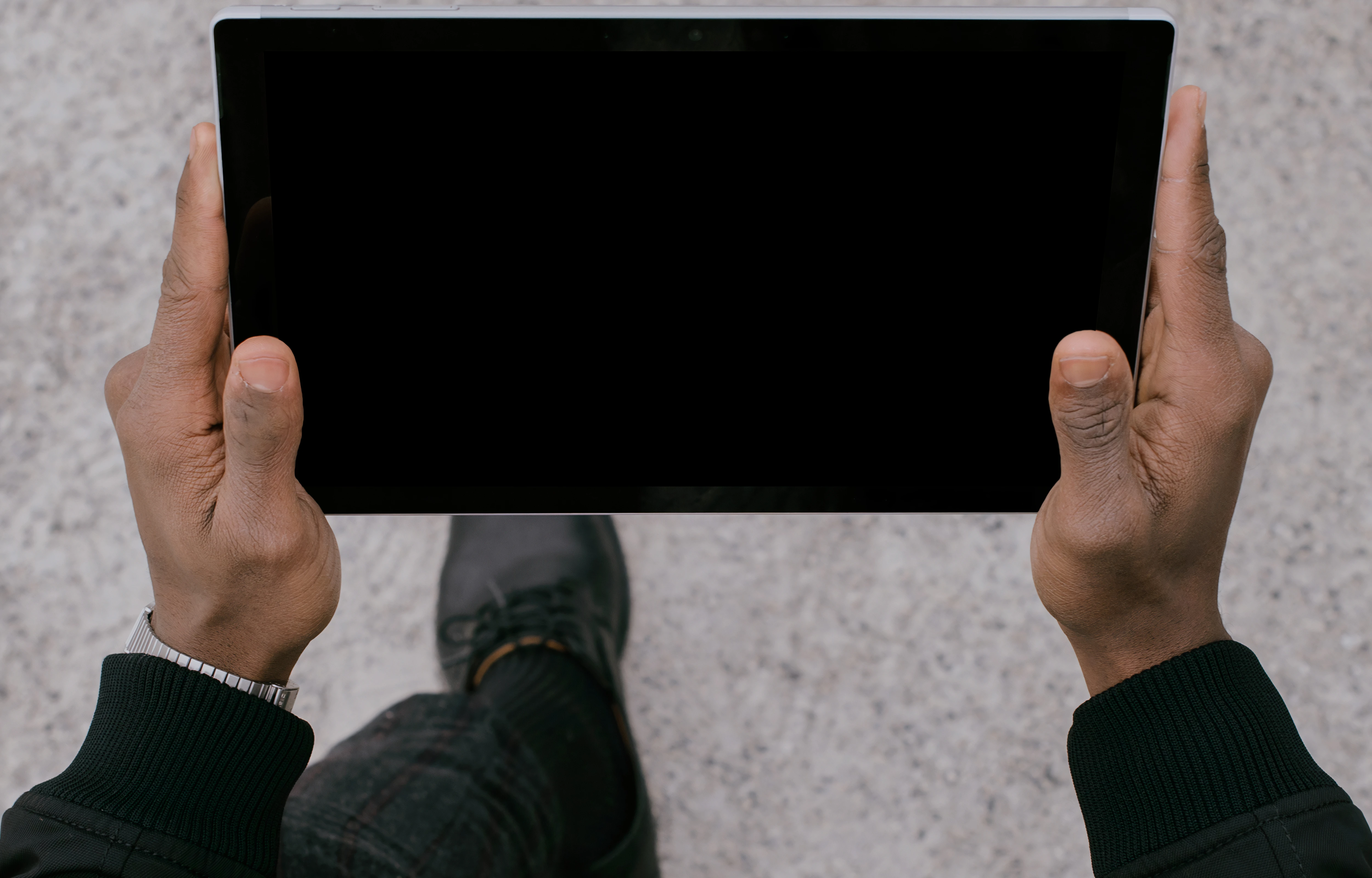 Microsoft Surface Laptop mockup held by a man