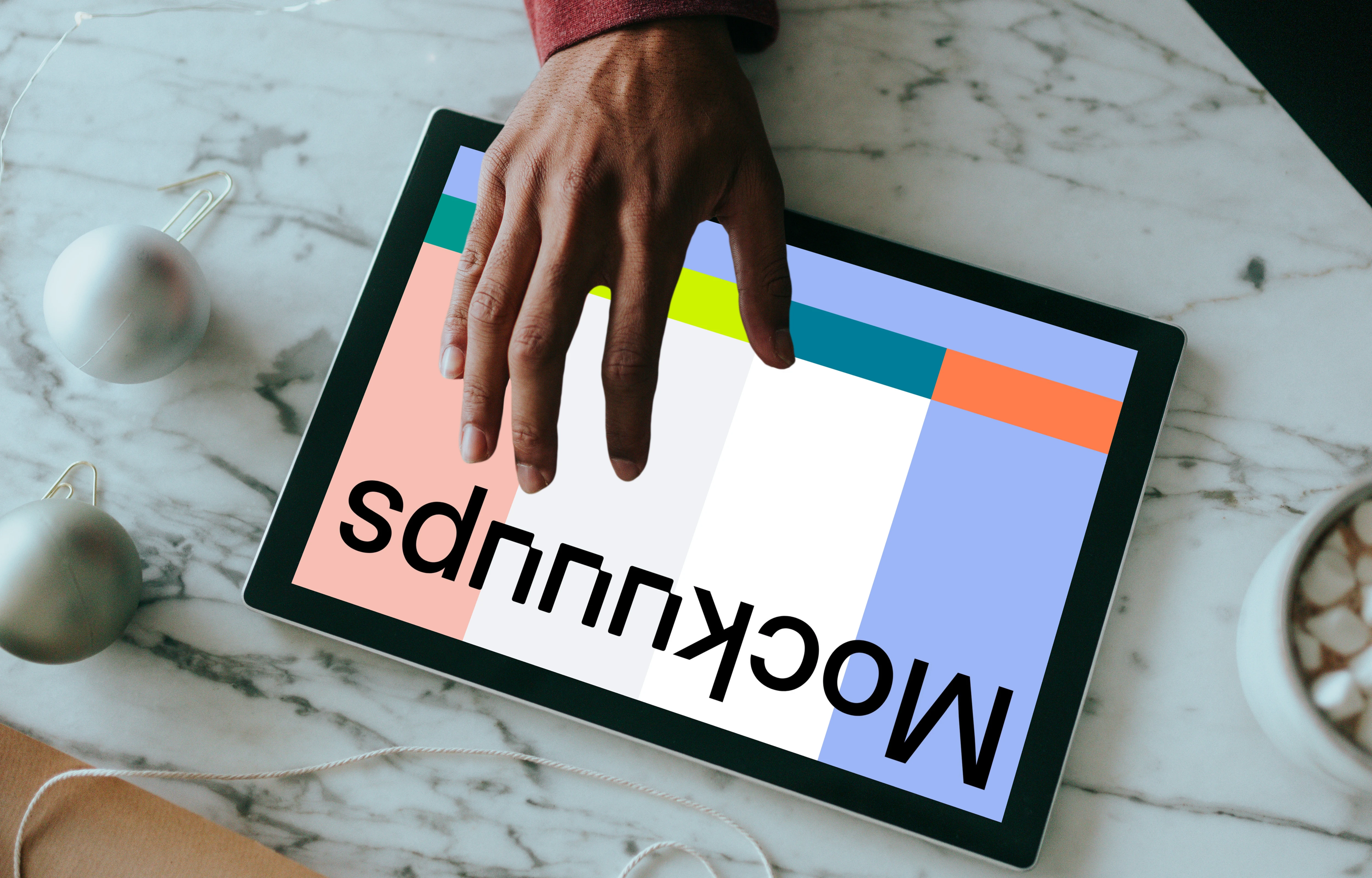 Microsoft Surface mockup held by a user on a marble table