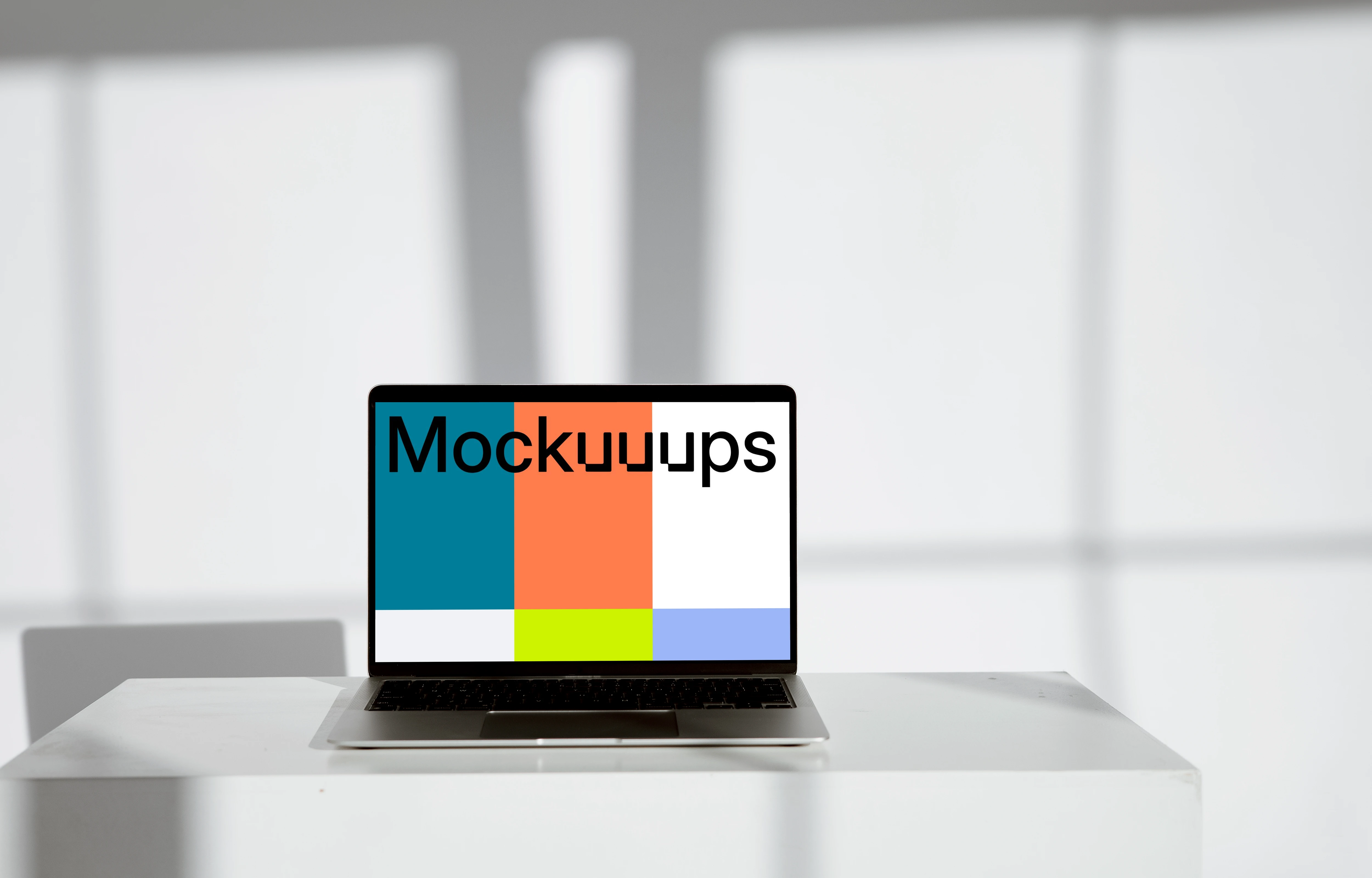 Minimal MacBook mockup on a white table