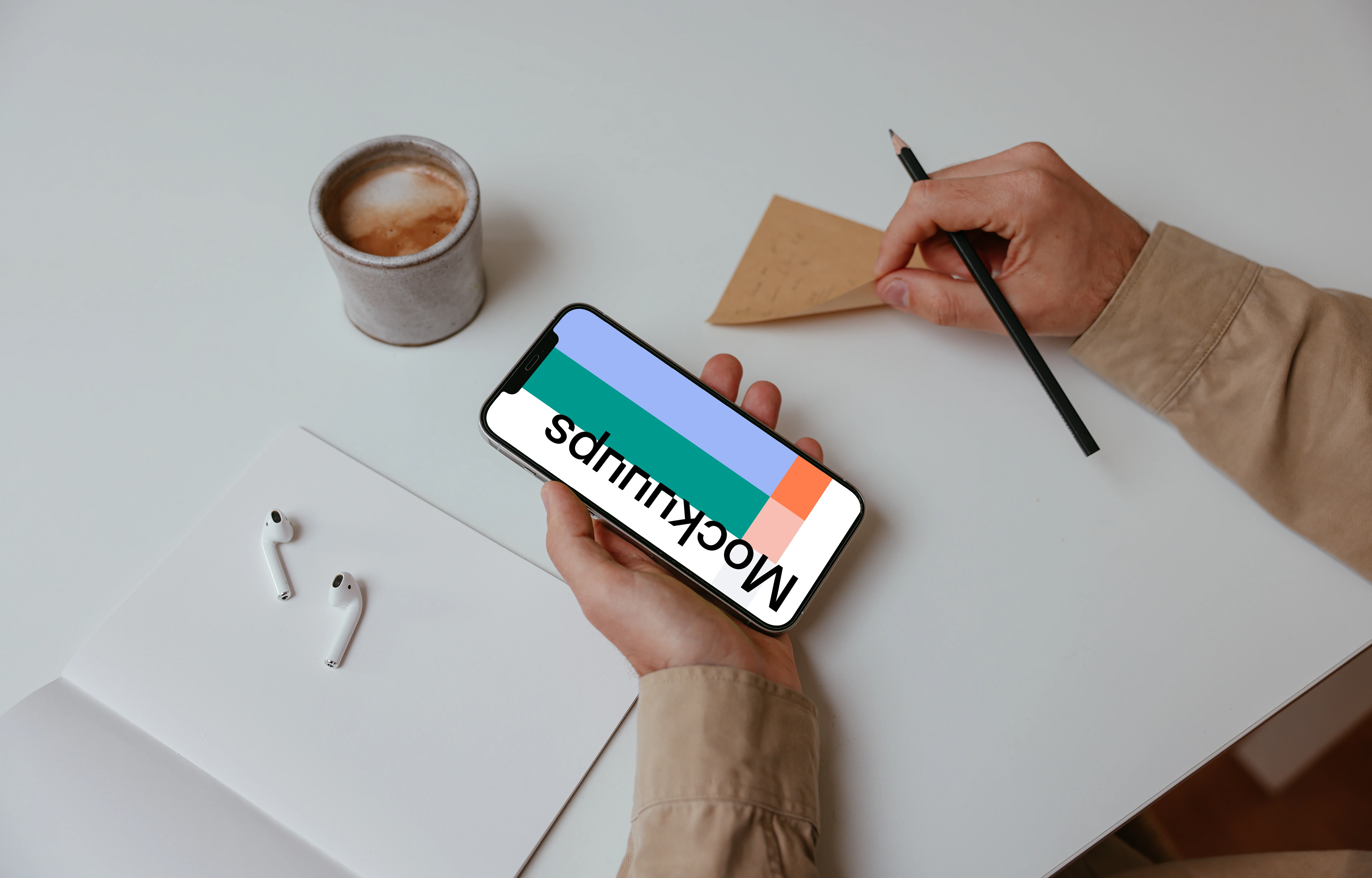 Person holding iPhone Mockup