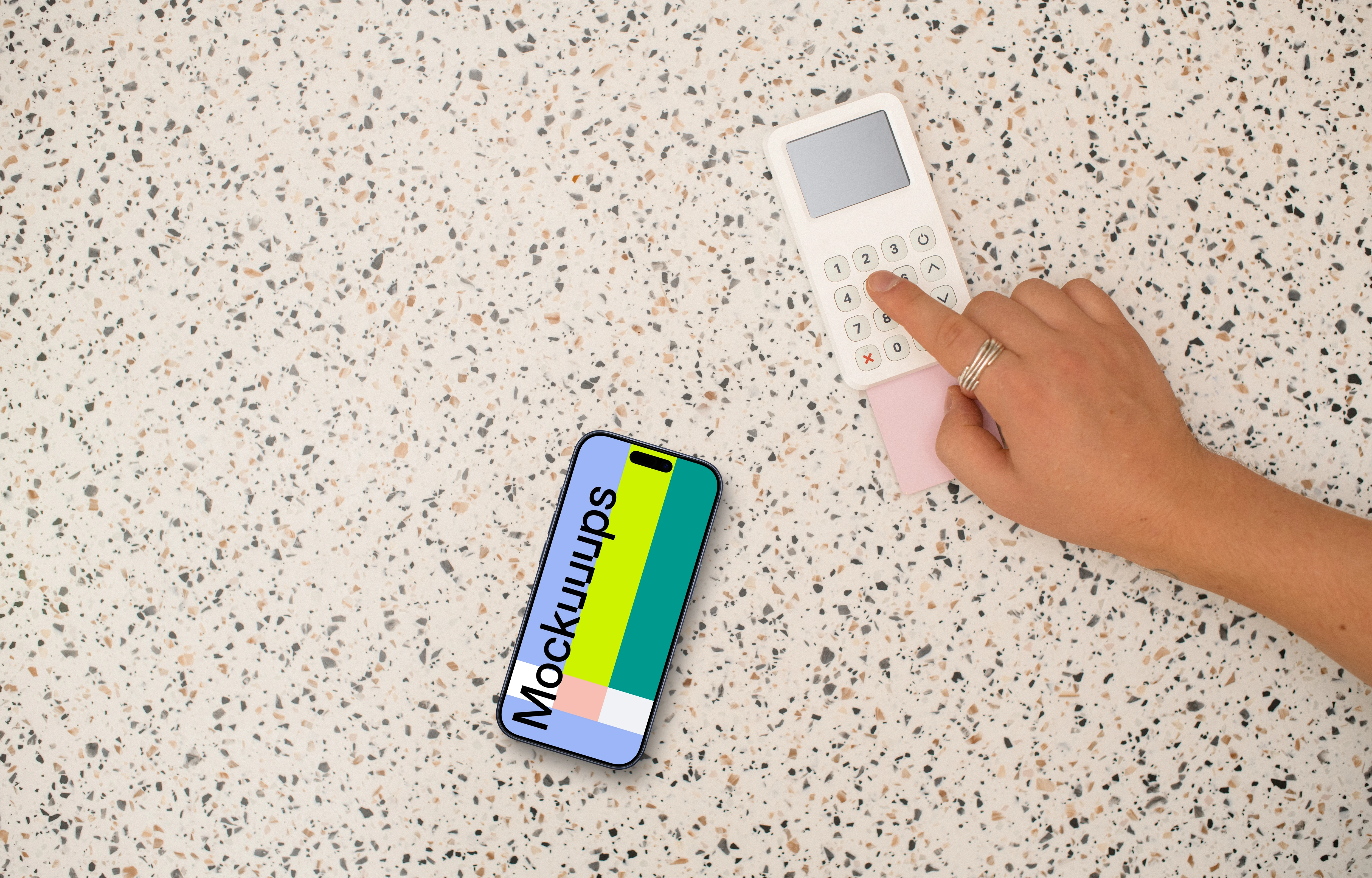 Person paying next to the iPhone mockup