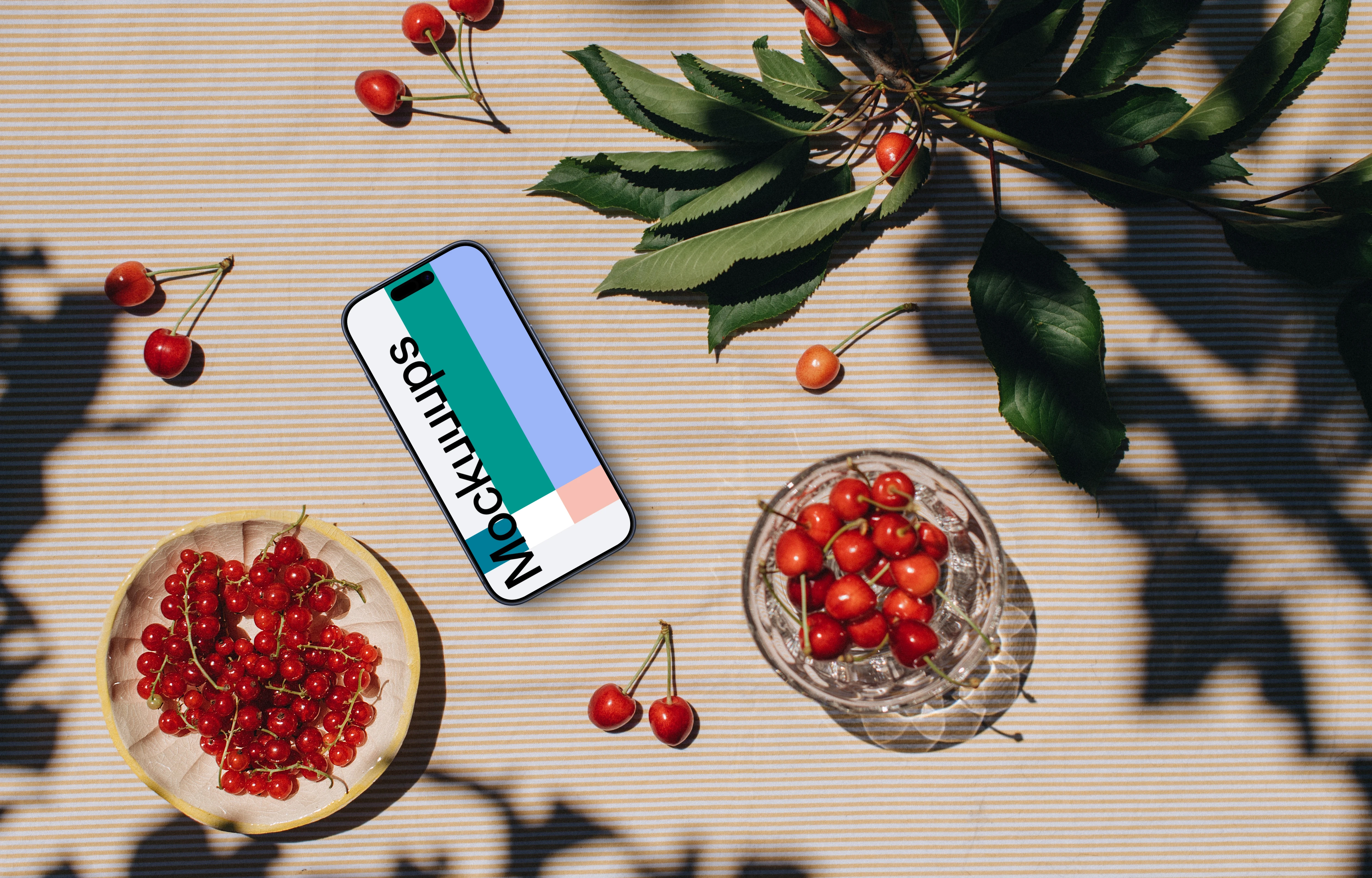 Phone mockup with a fresh fruit on the table
