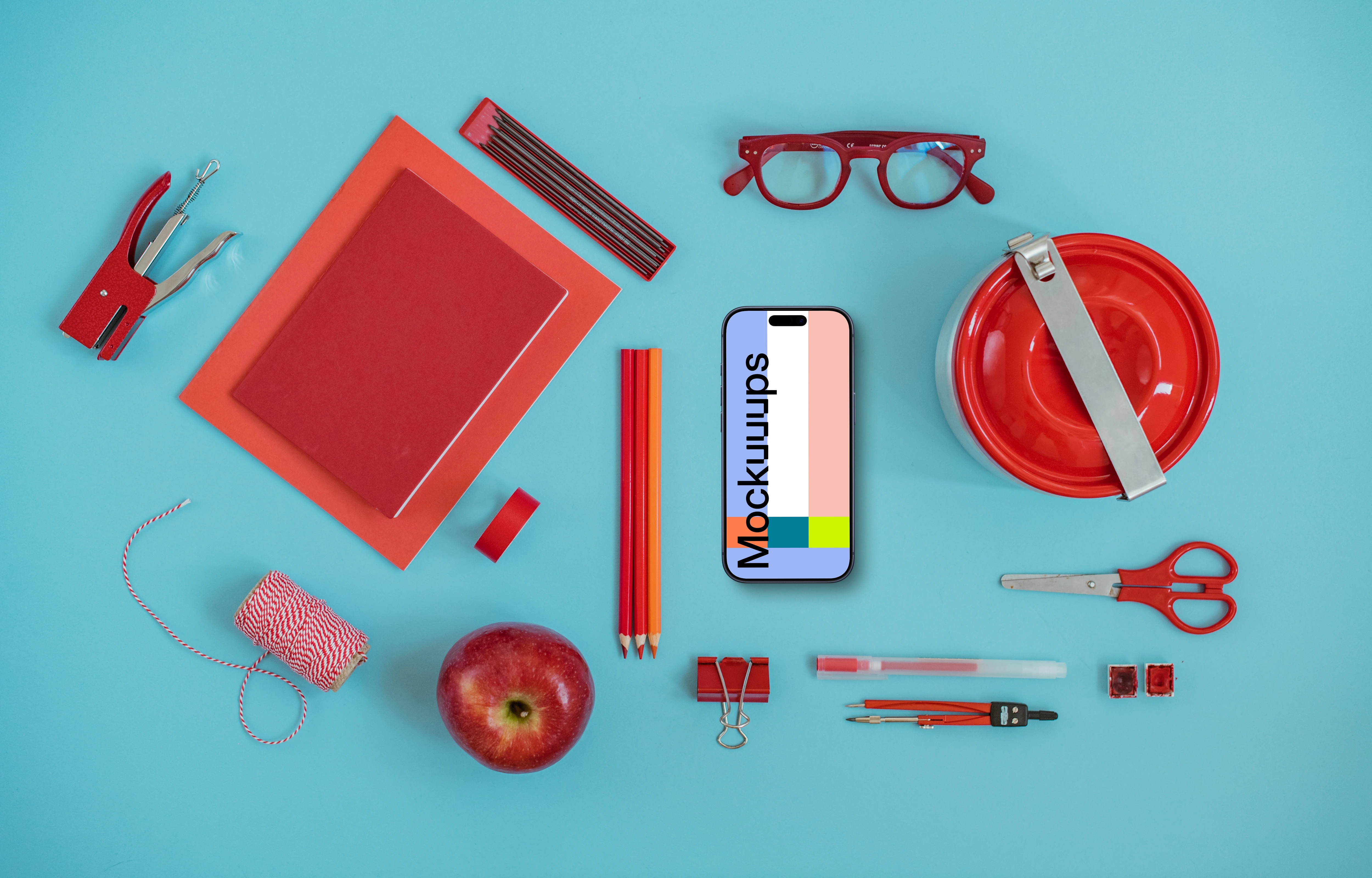 Phone mockup with a school equipment around