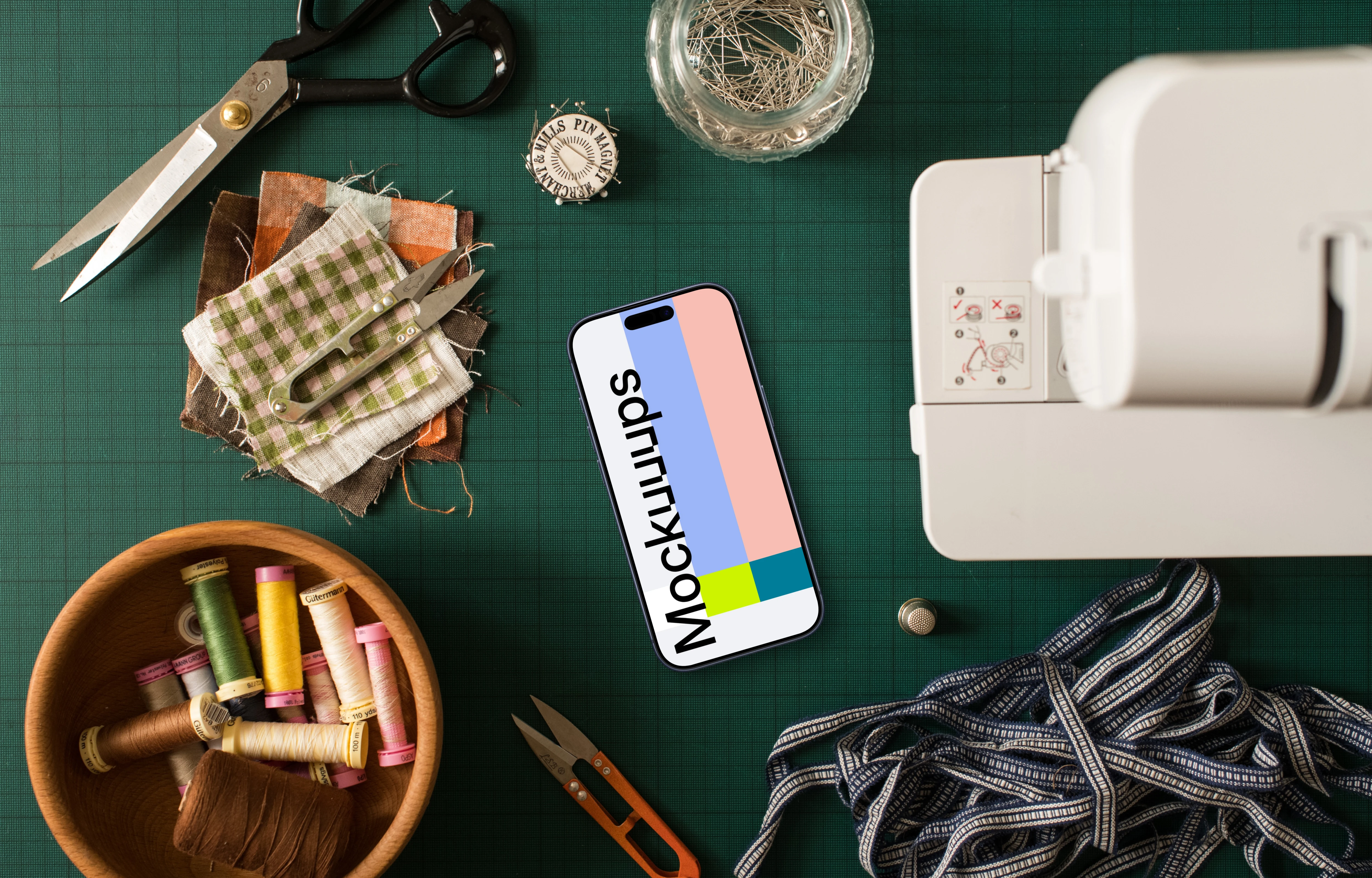 Smartphone mockup next to the sewing machine