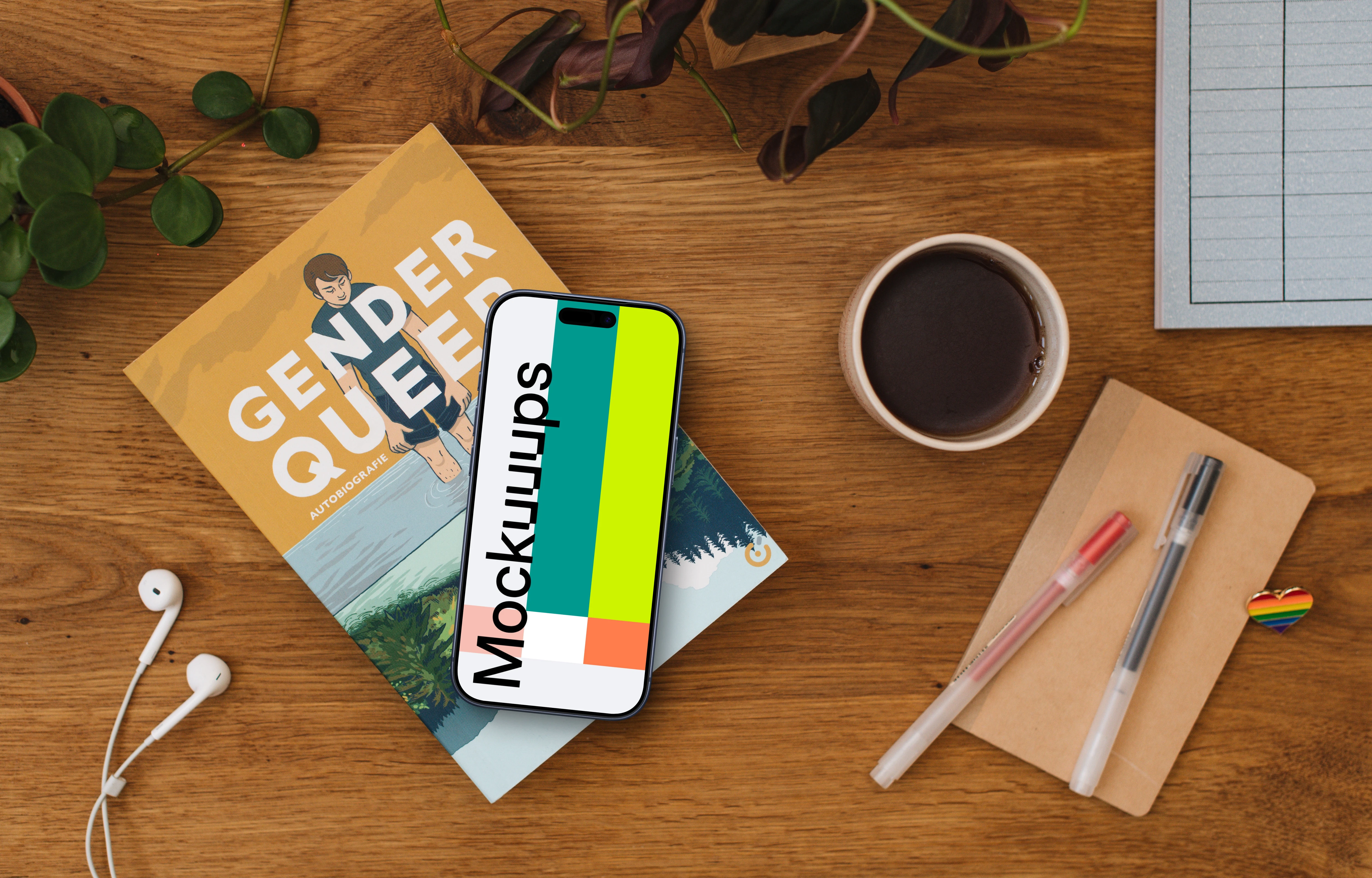 Smartphone mockup on a wooden table with rainbow heart pin