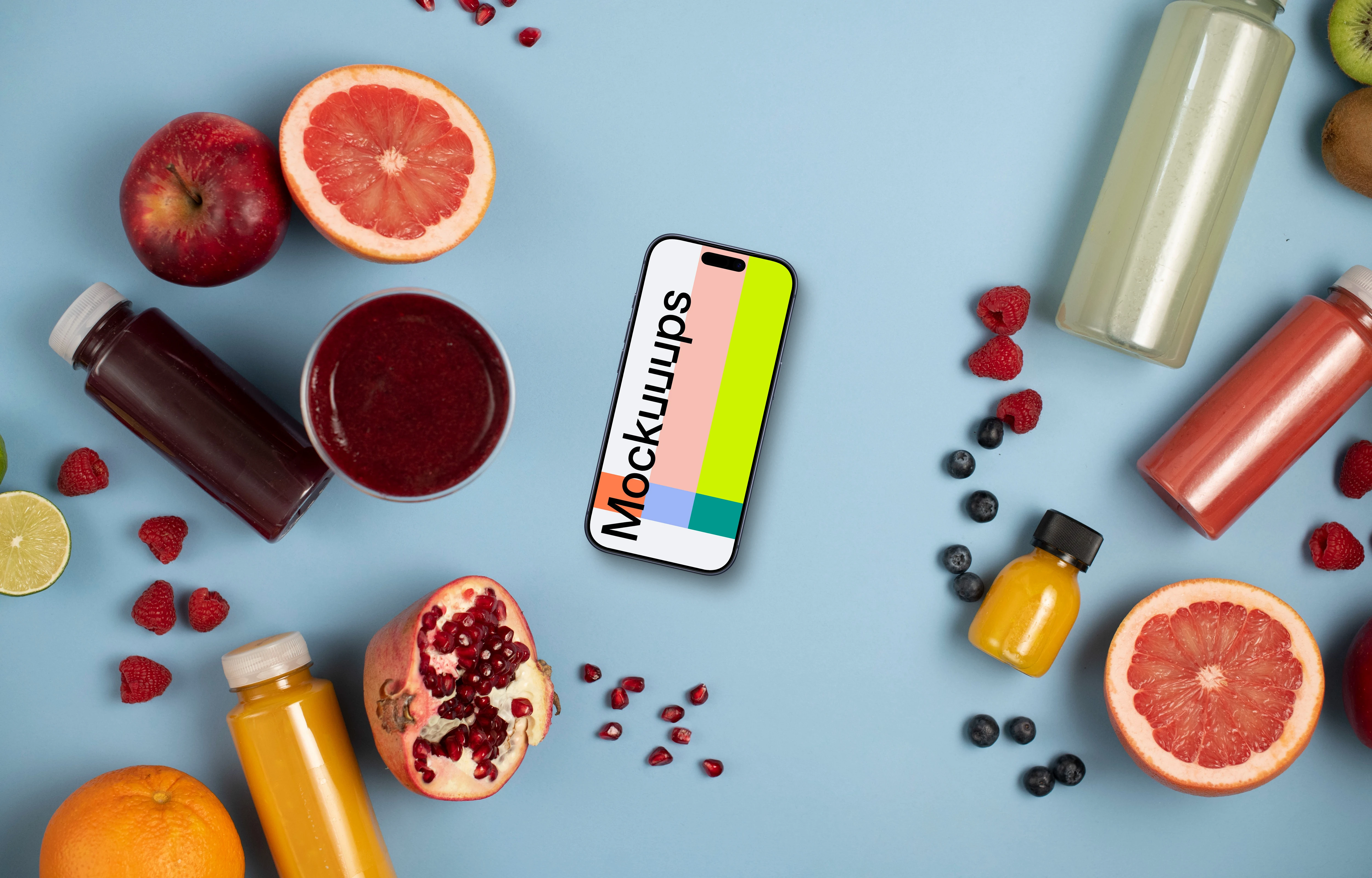 Smartphone mockup surrounded by fruits and juices