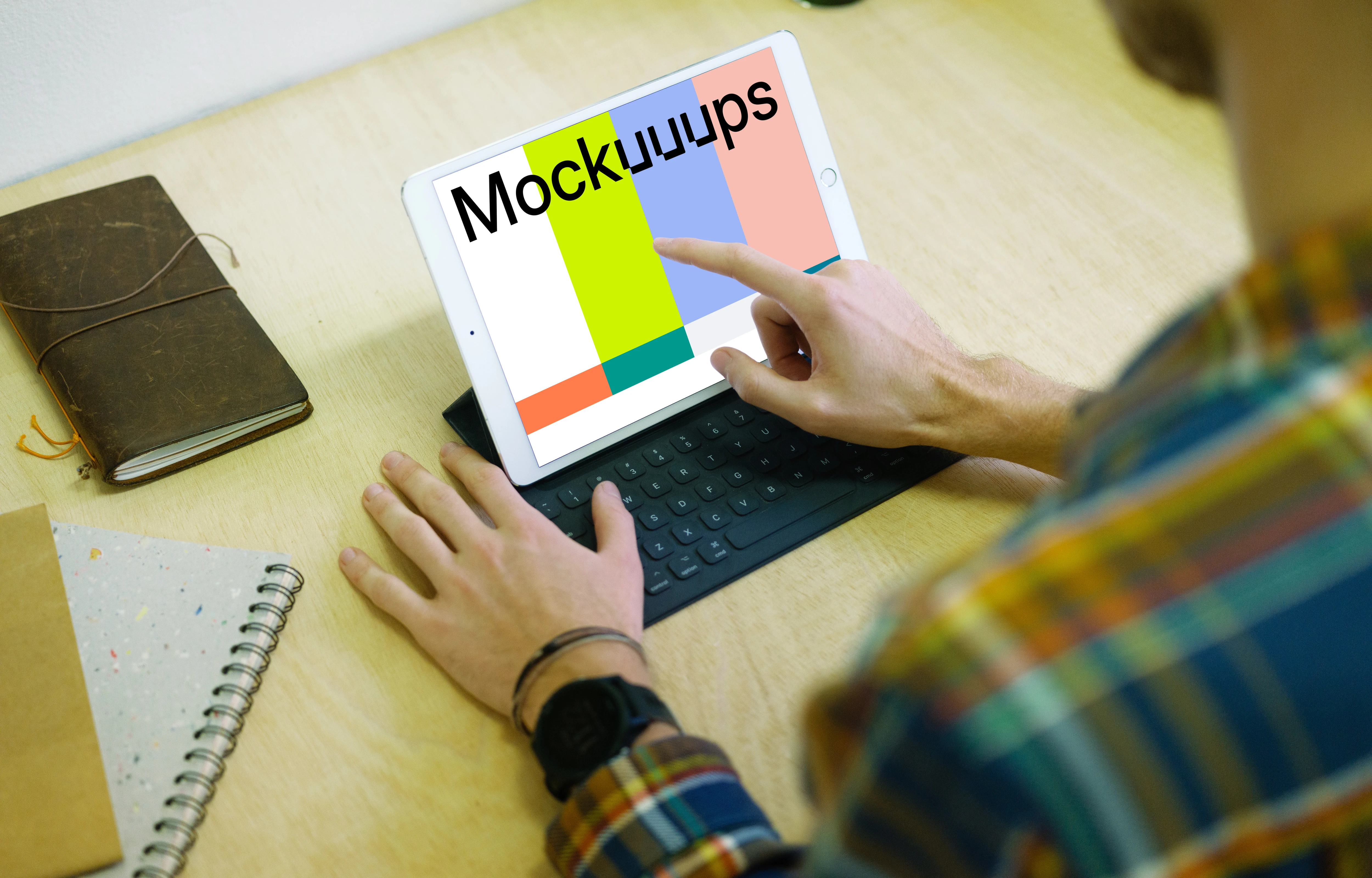 Tapping on iPad Pro mockup with keyboard