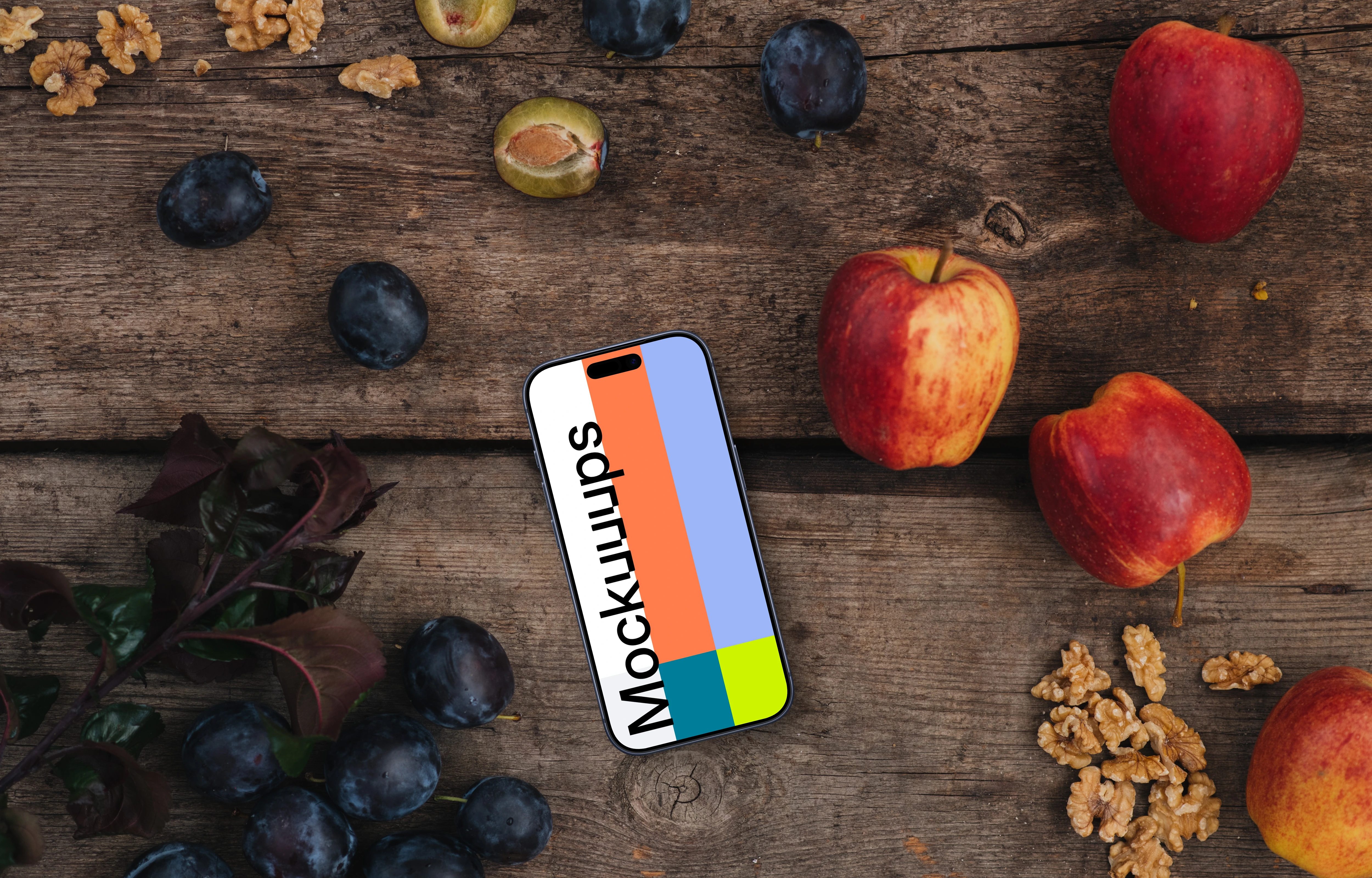 Top view of phone mockup on the wooden desk