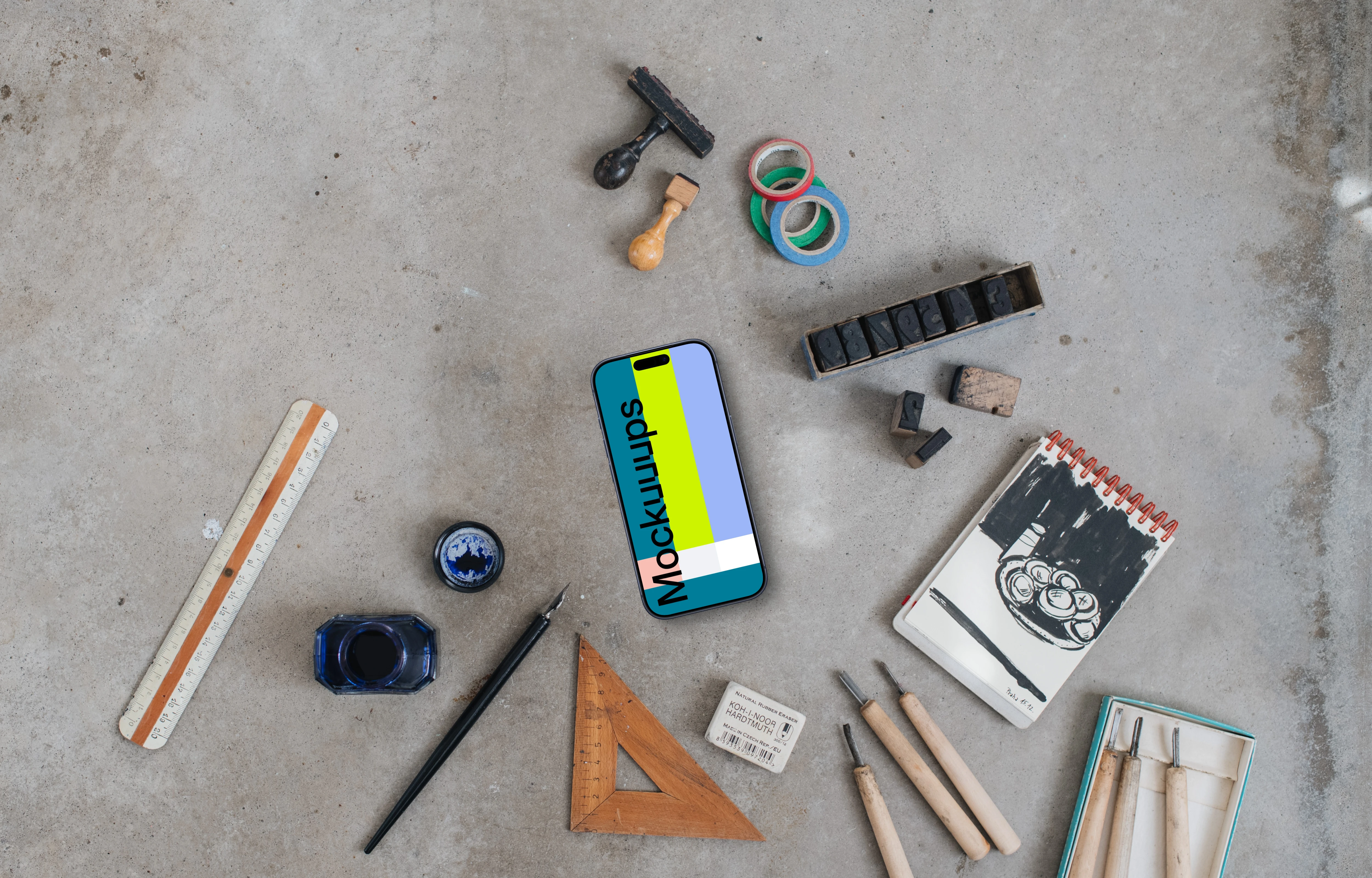 Top view of phone mockup with paintings