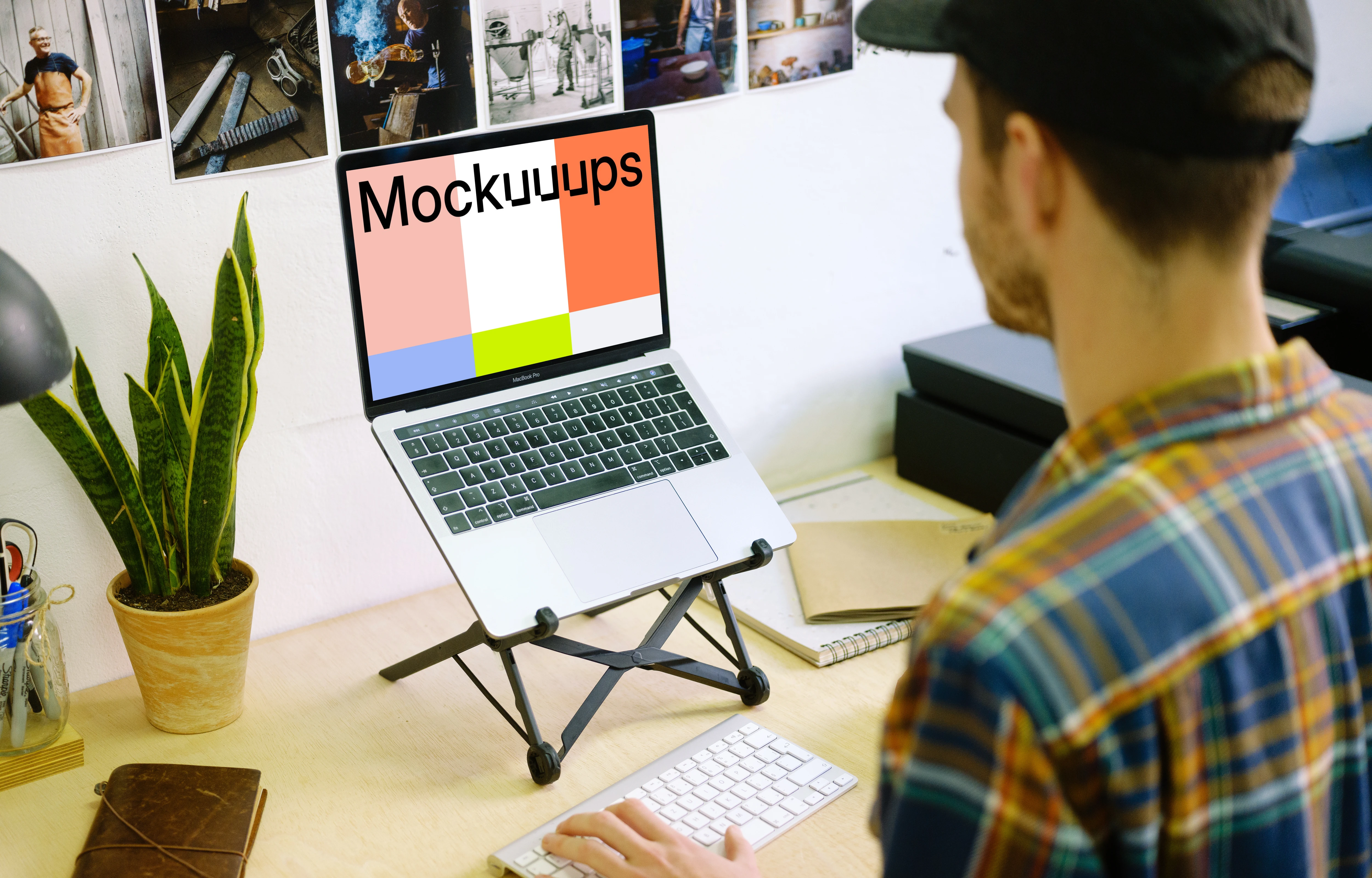 Typing on Macbook Pro mockup with desk stand