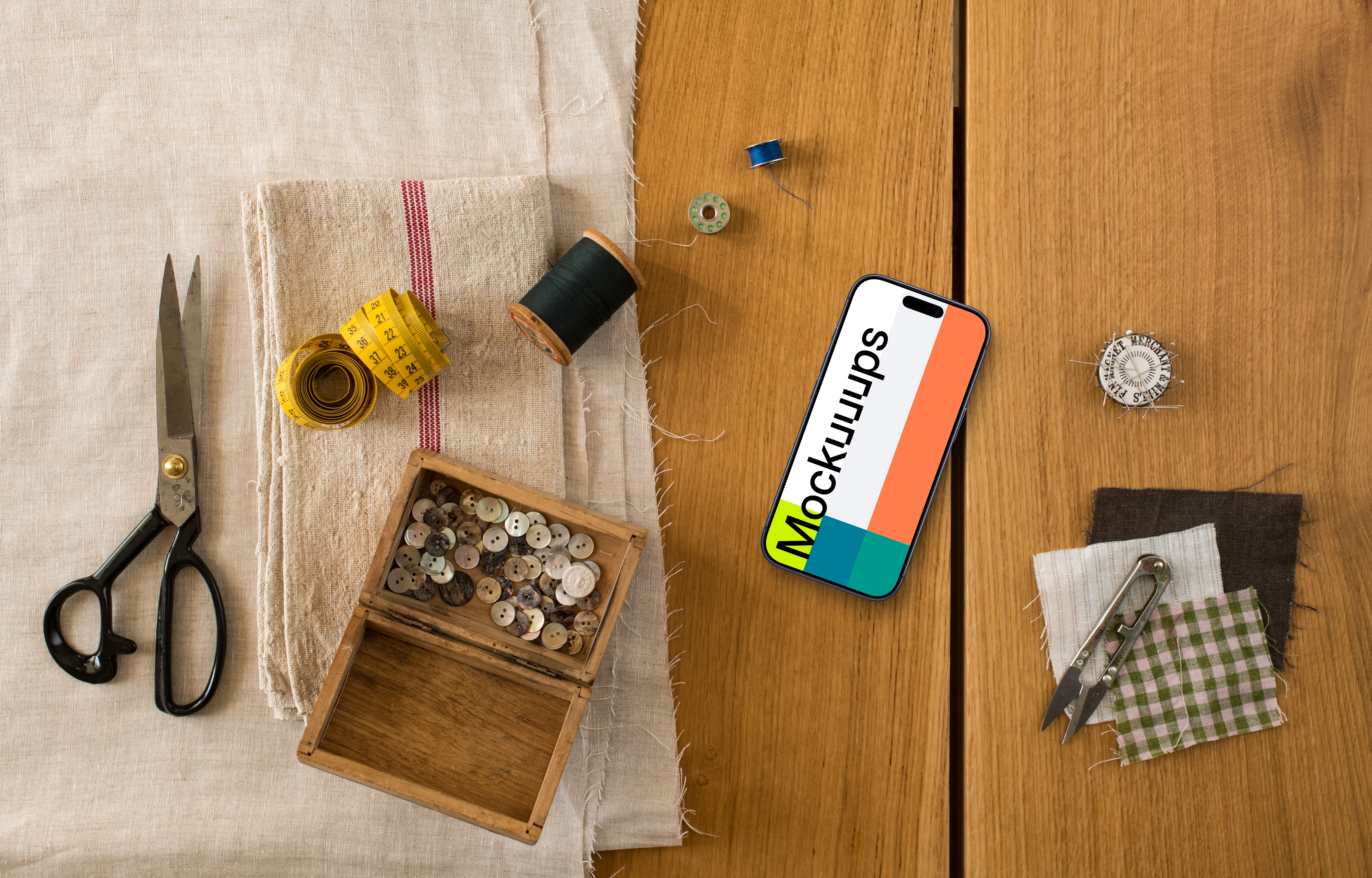 Smartphone mockup and natural fabrics on the wooden table