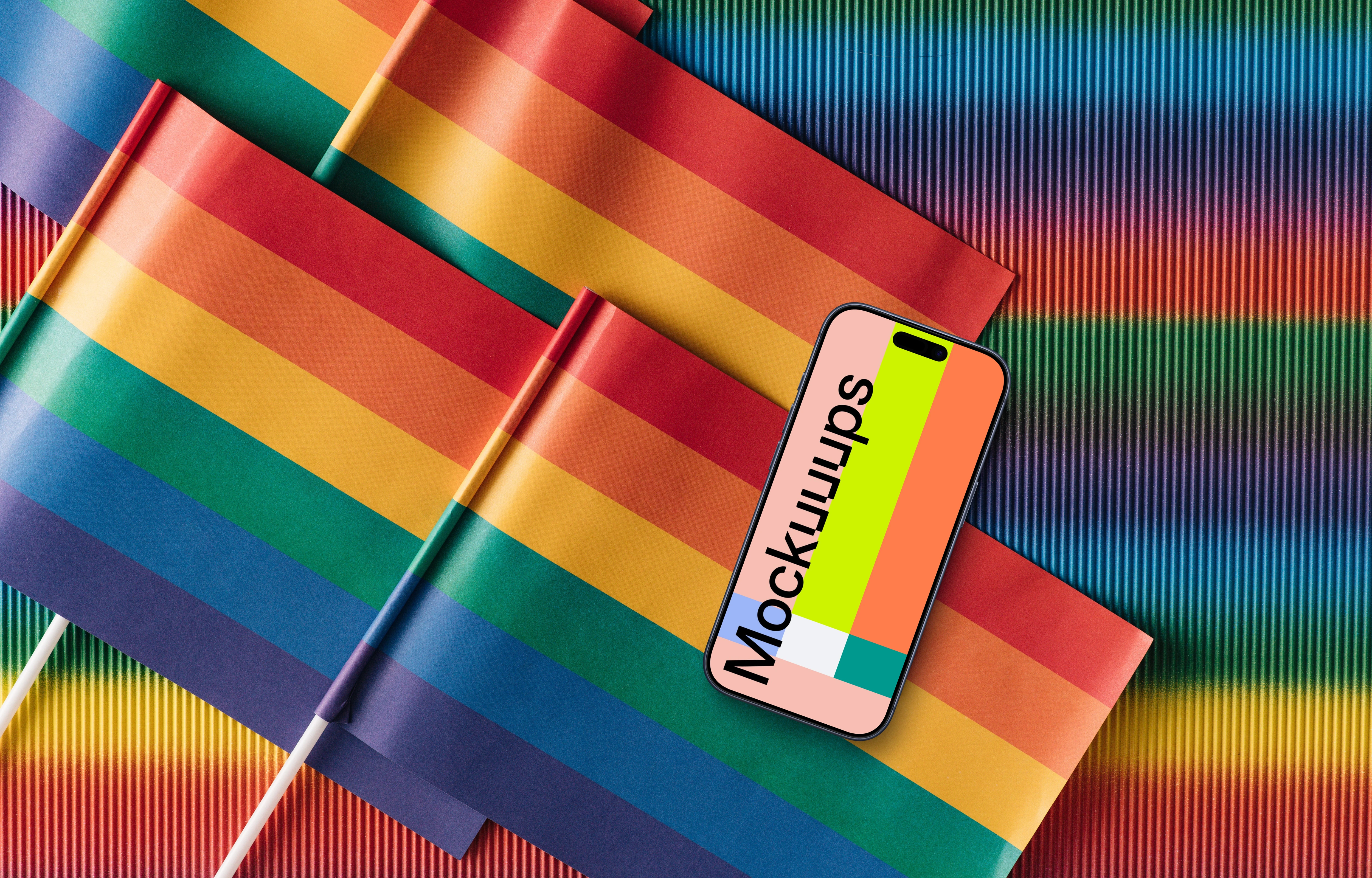 Smartphone mockup laying on pride flags