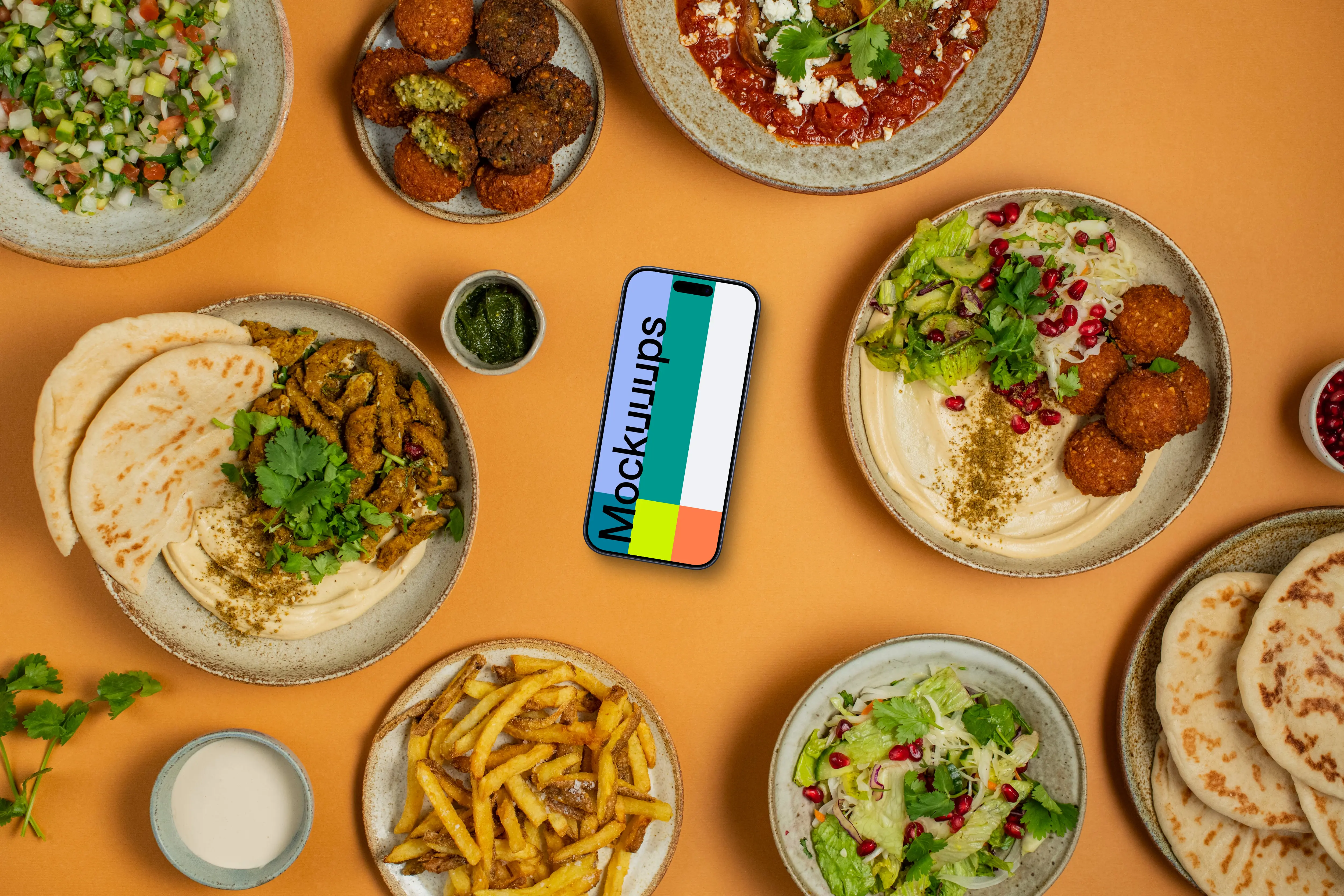Middle Eastern dishes around Smartphone mockup