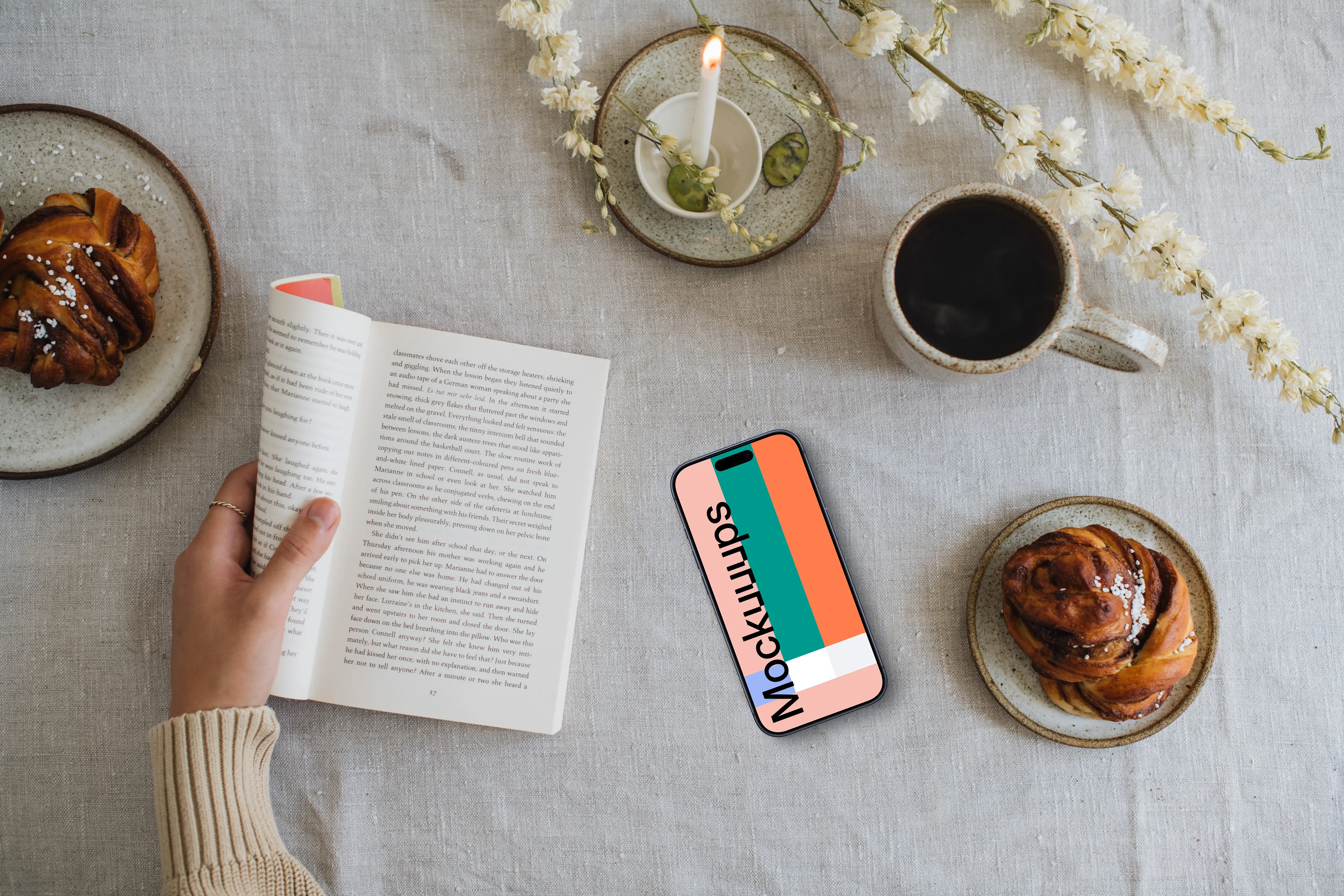 Reading a book with smartphone mockup on the side