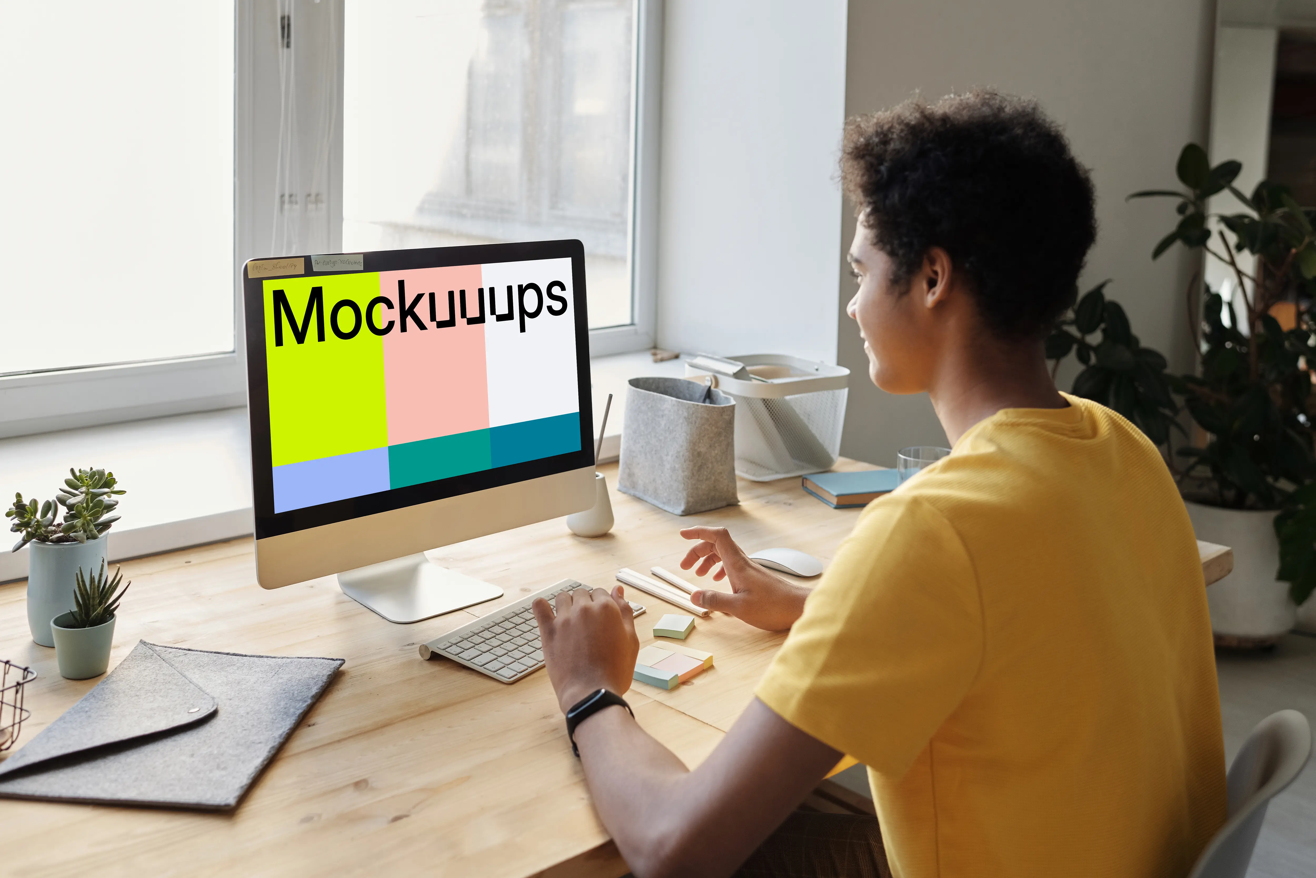 Young boy smiling at an iMac mockup