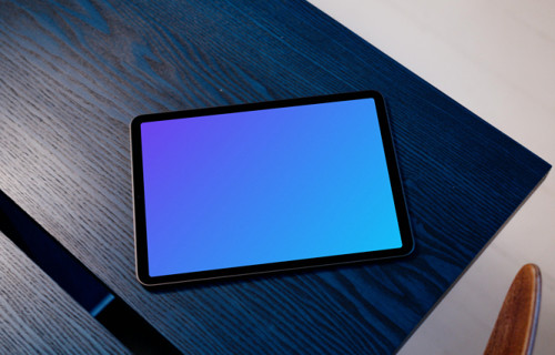 iPad Air mockup on a blue table with a white background