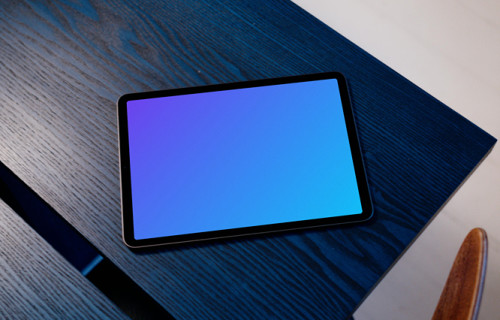 iPad Air mockup on a blue table with a white background
