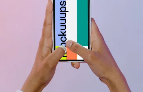 iPhone mockup in a user’s hand
