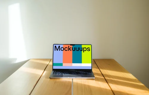 MacBook Pro mockup on a wooden table against a white background