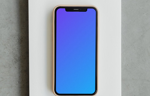 Minimal iPhone mockup on a jotter