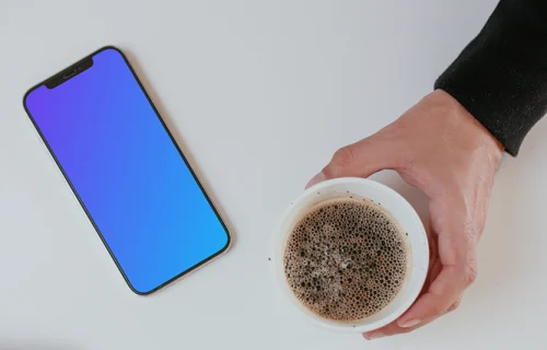 Minimal iPhone mockup on a table with a cup of coffee by the side