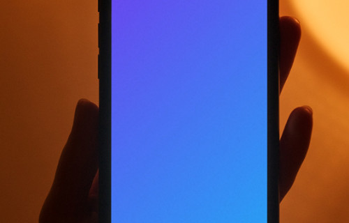 Night iPhone mockup being held by user