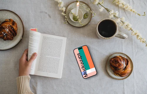 Reading a book with smartphone mockup on the side