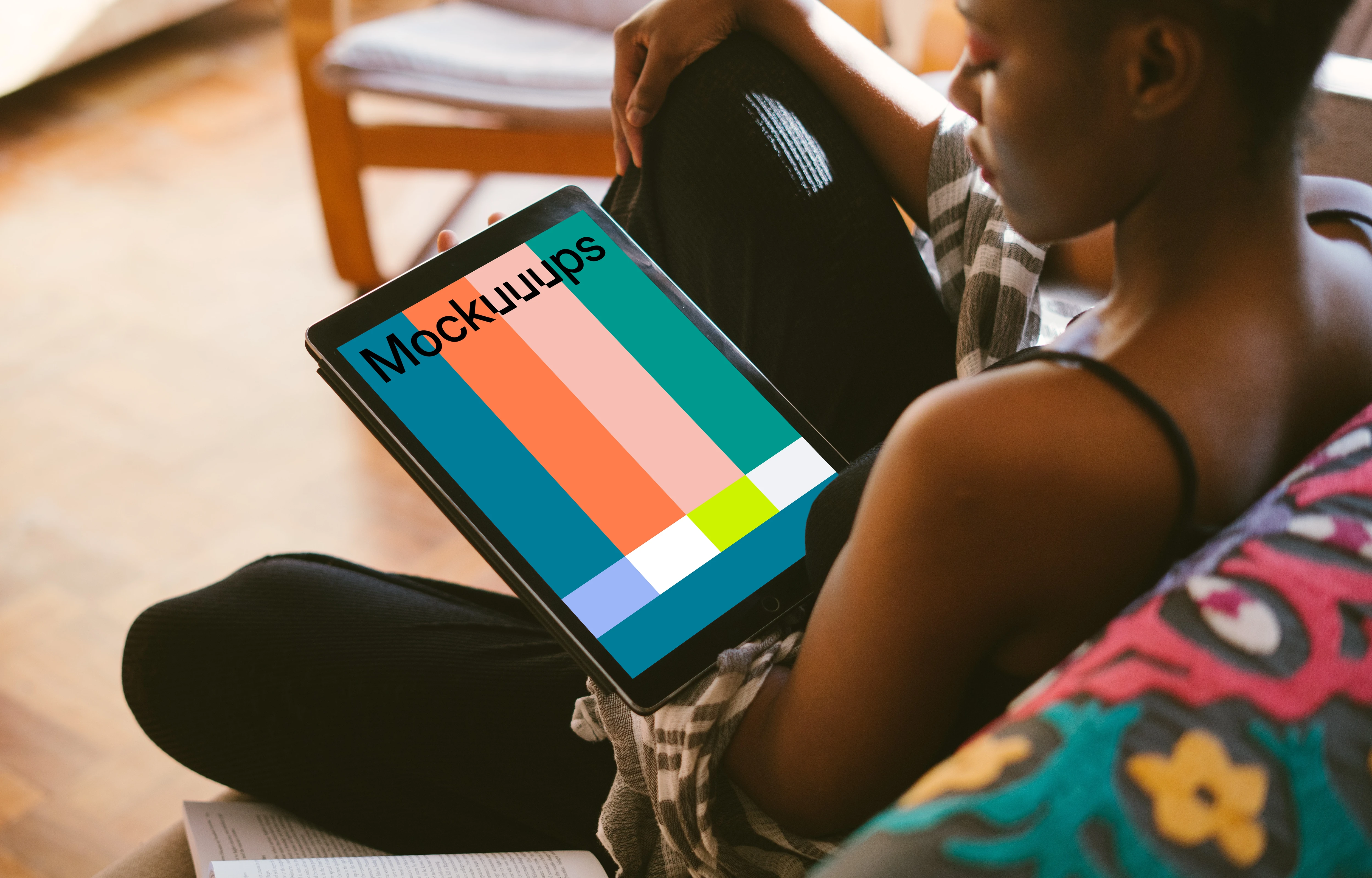 iPad Pro mockup in dark-skinned black lady's hand for study