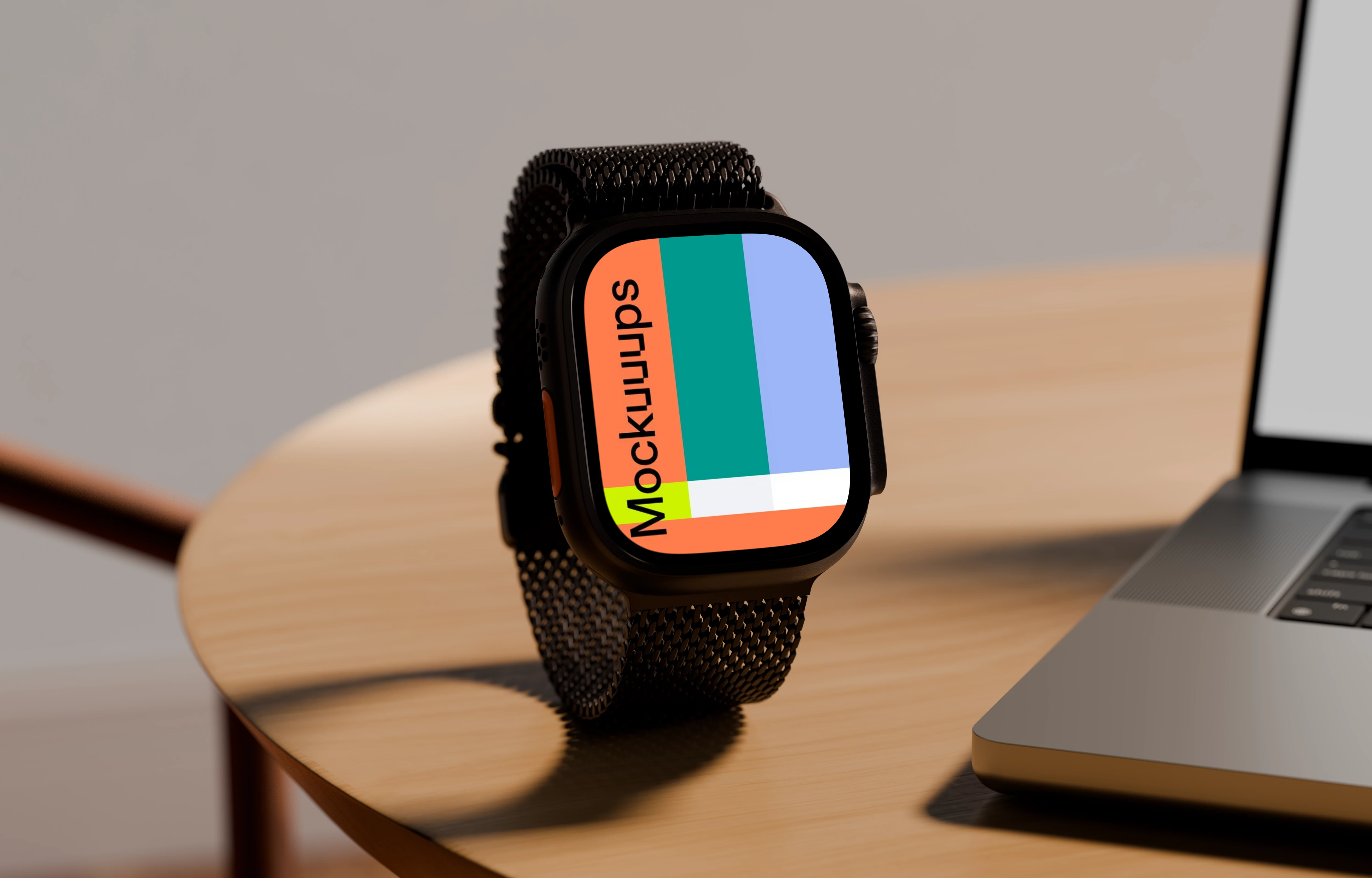 Apple Watch Ultra mockup on a wooden table next to a laptop