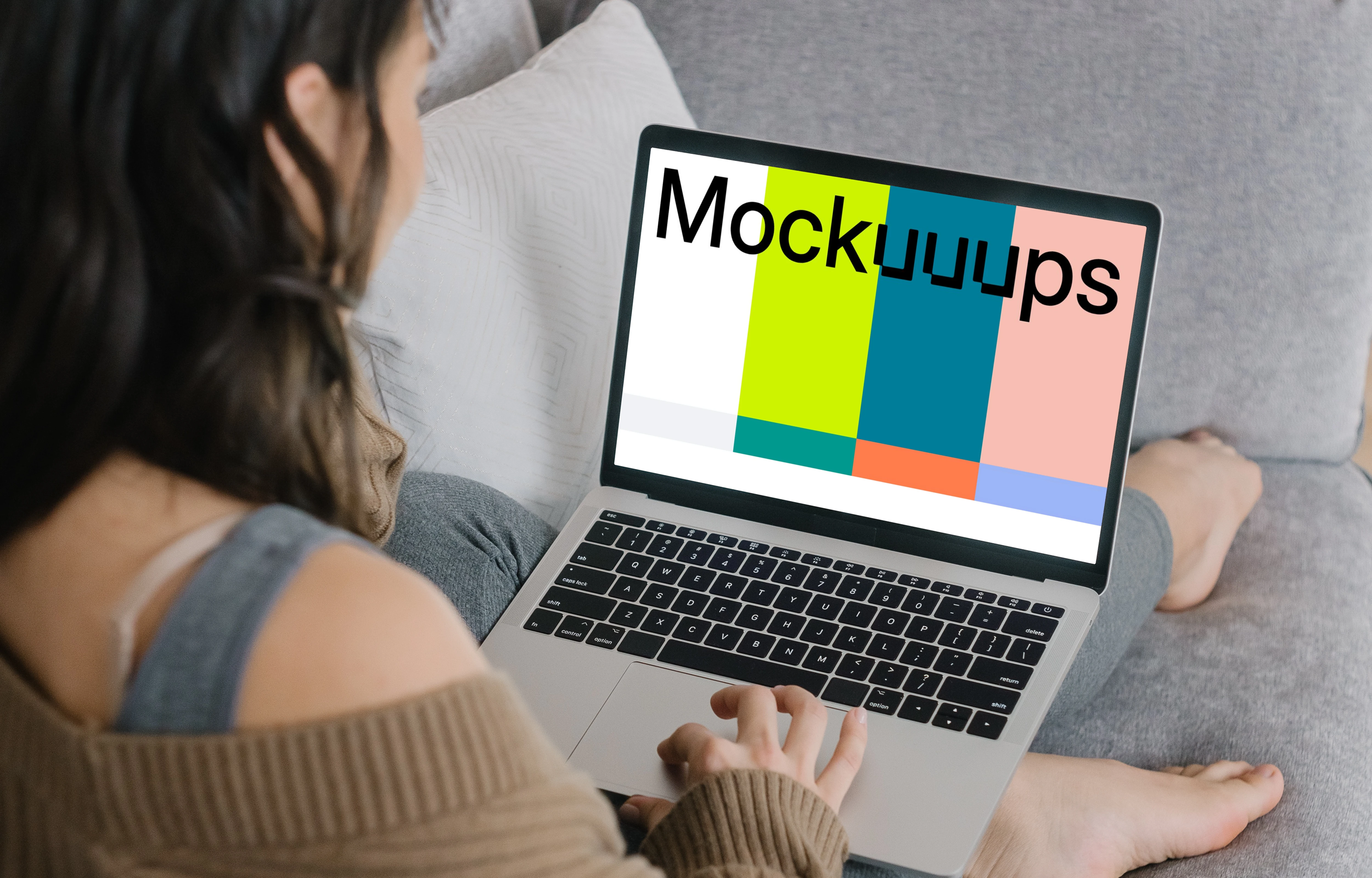 MacBook Pro mockup on a lady’s lap laying on a couch