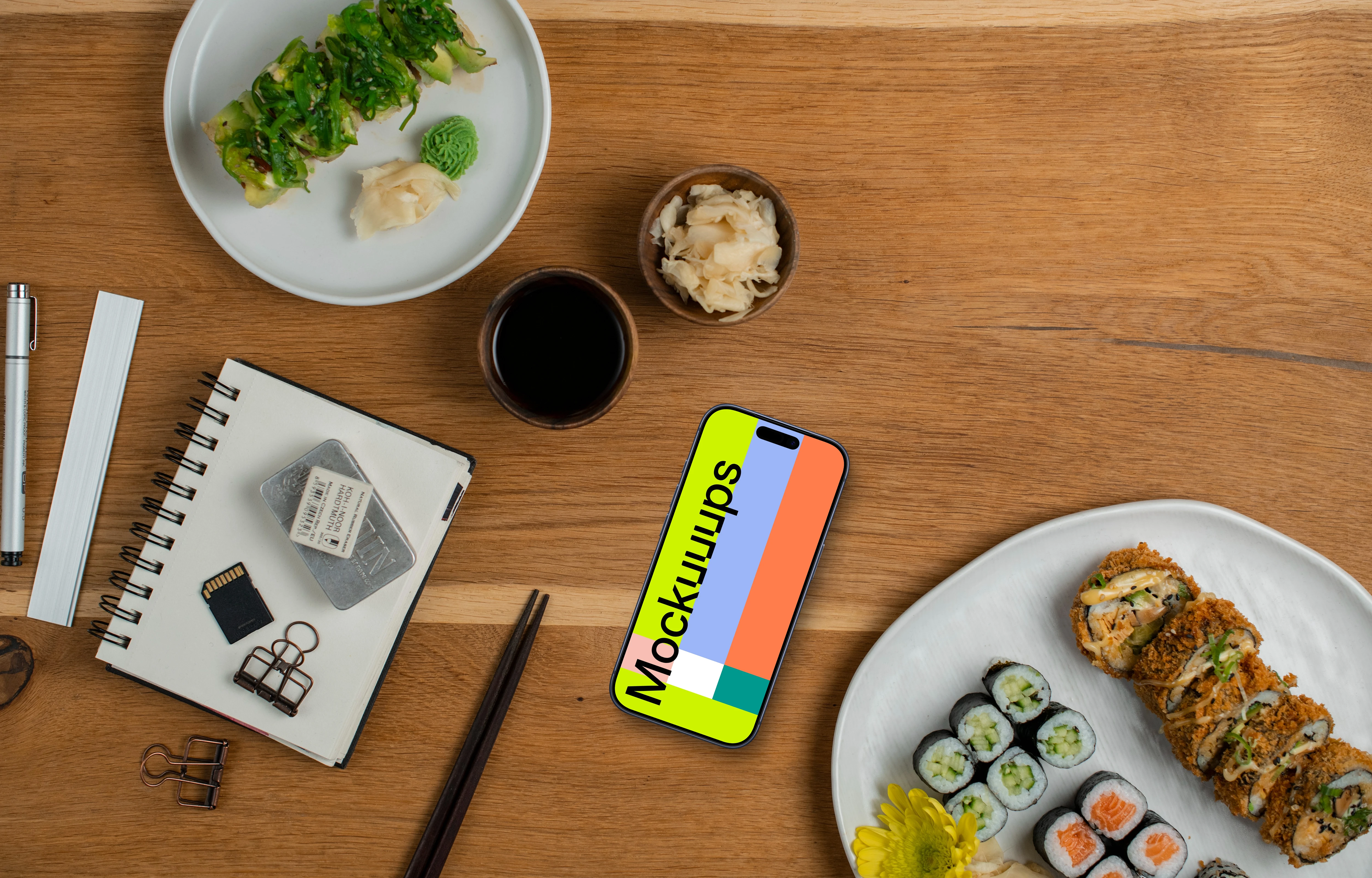 Smartphone mockup surrounded by sushi and decorations
