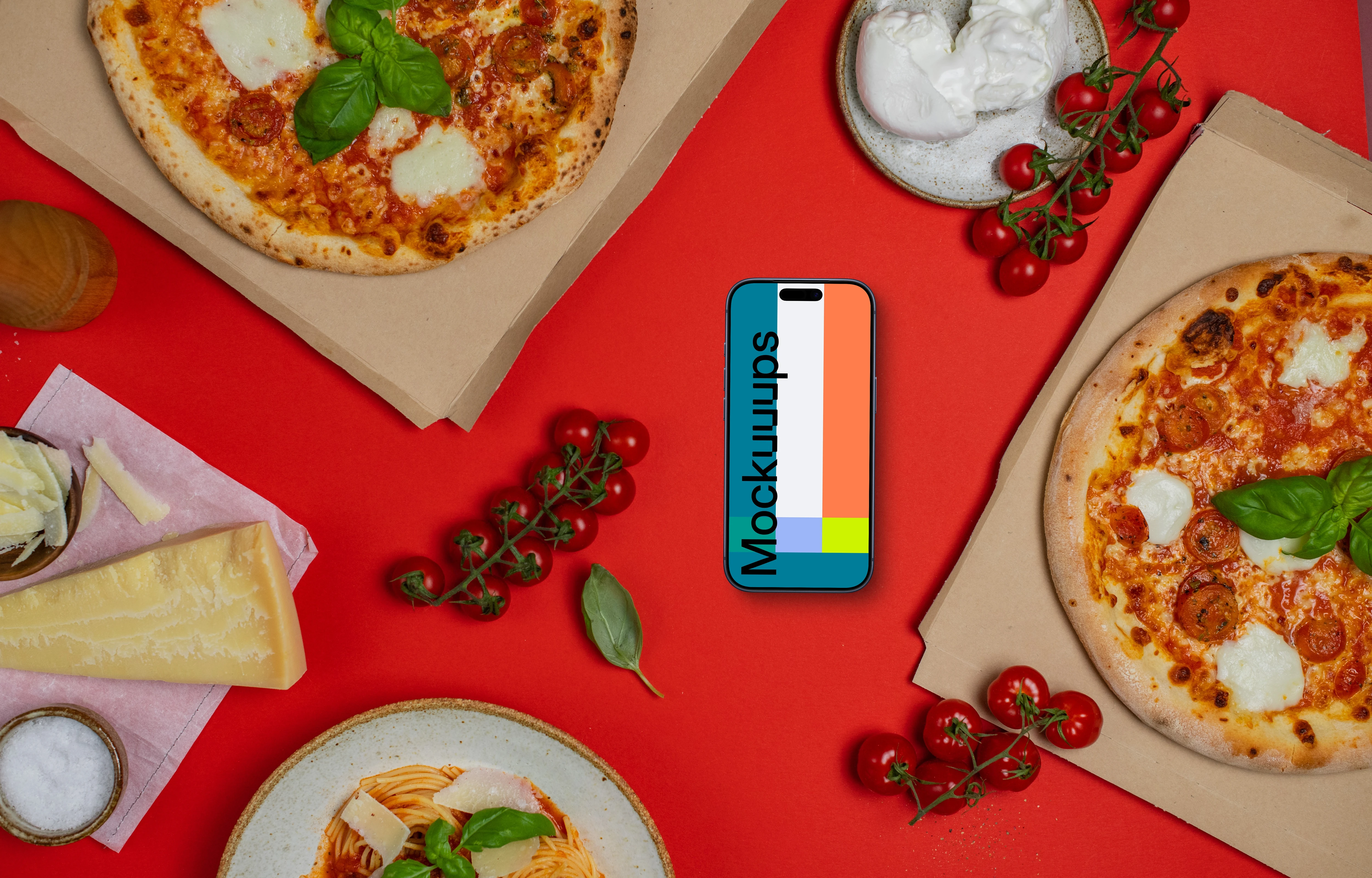 Phone mockup between pizza boxes 