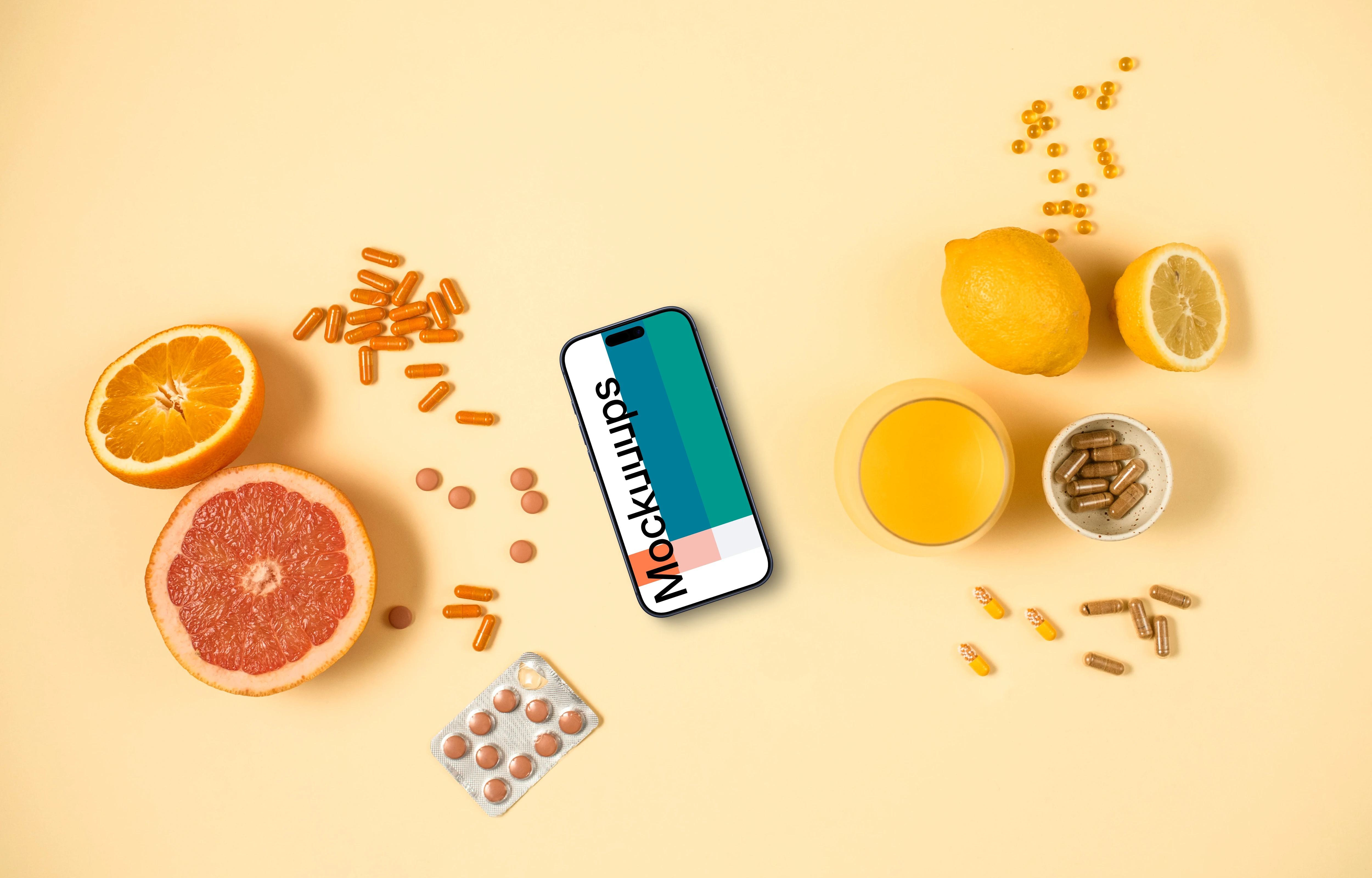 Phone surrounded by pills and citrus fruits