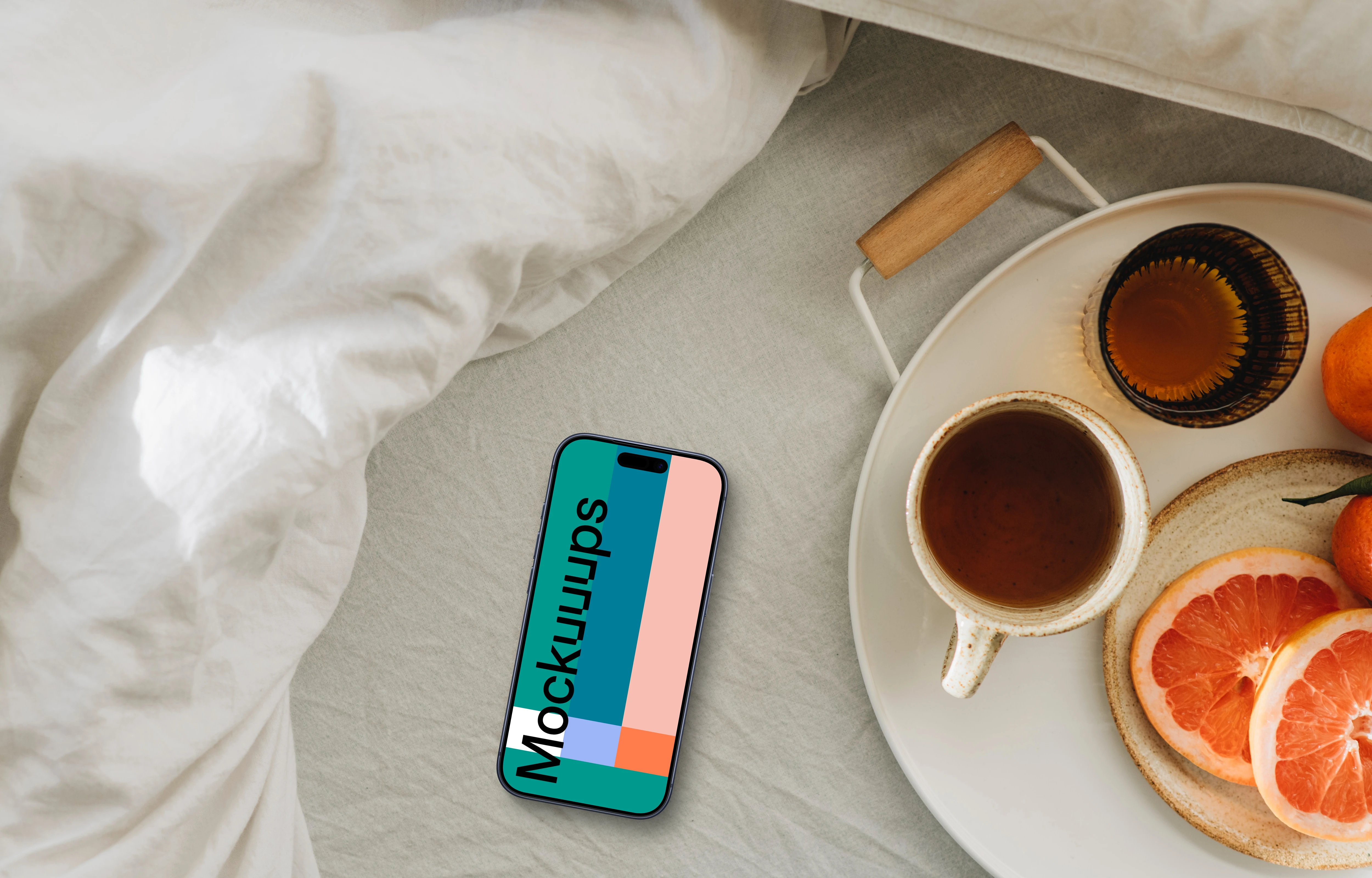 Sun-kissed breakfast scene including an iPhone mockup