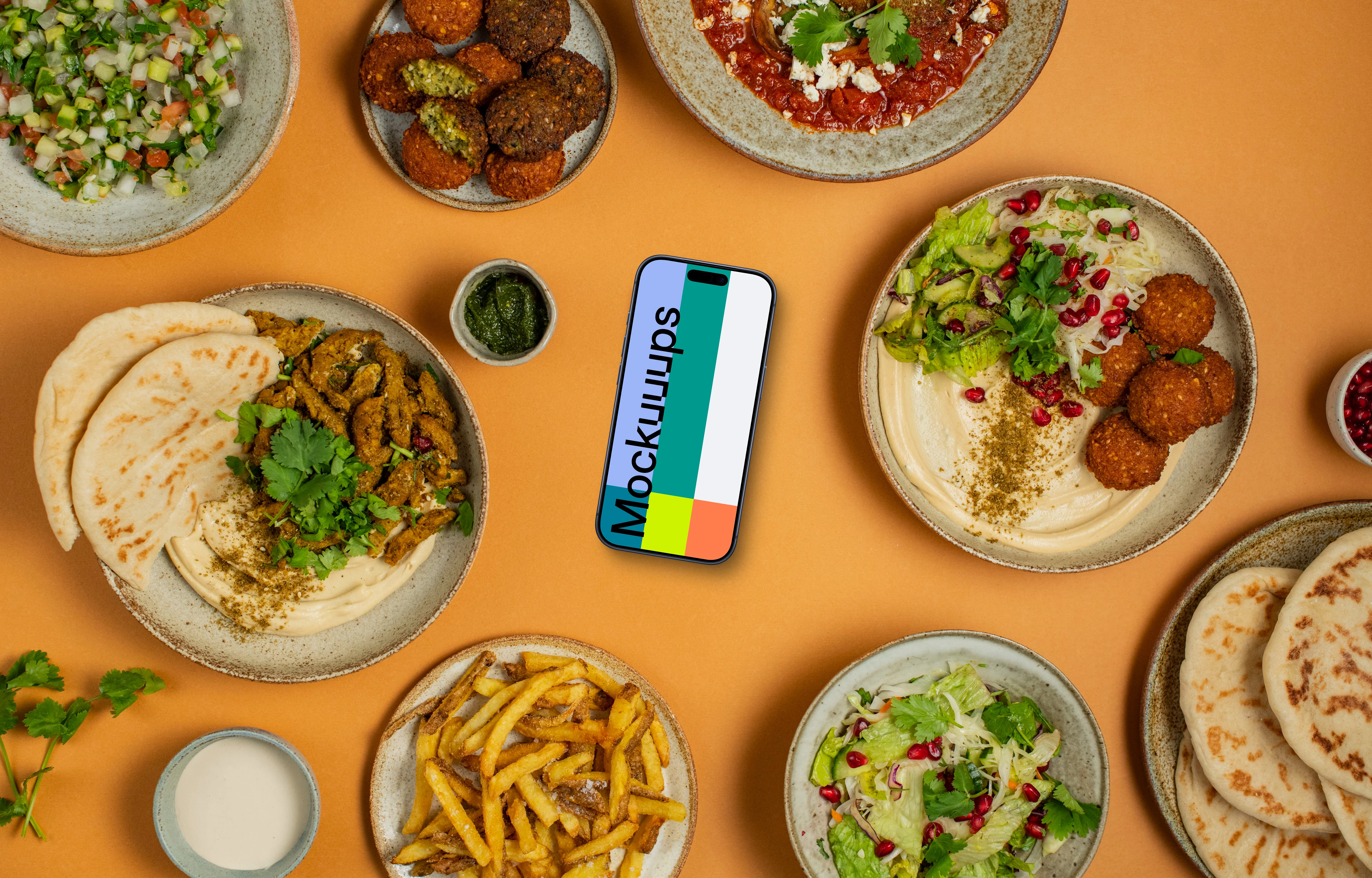 Middle Eastern dishes around Smartphone mockup