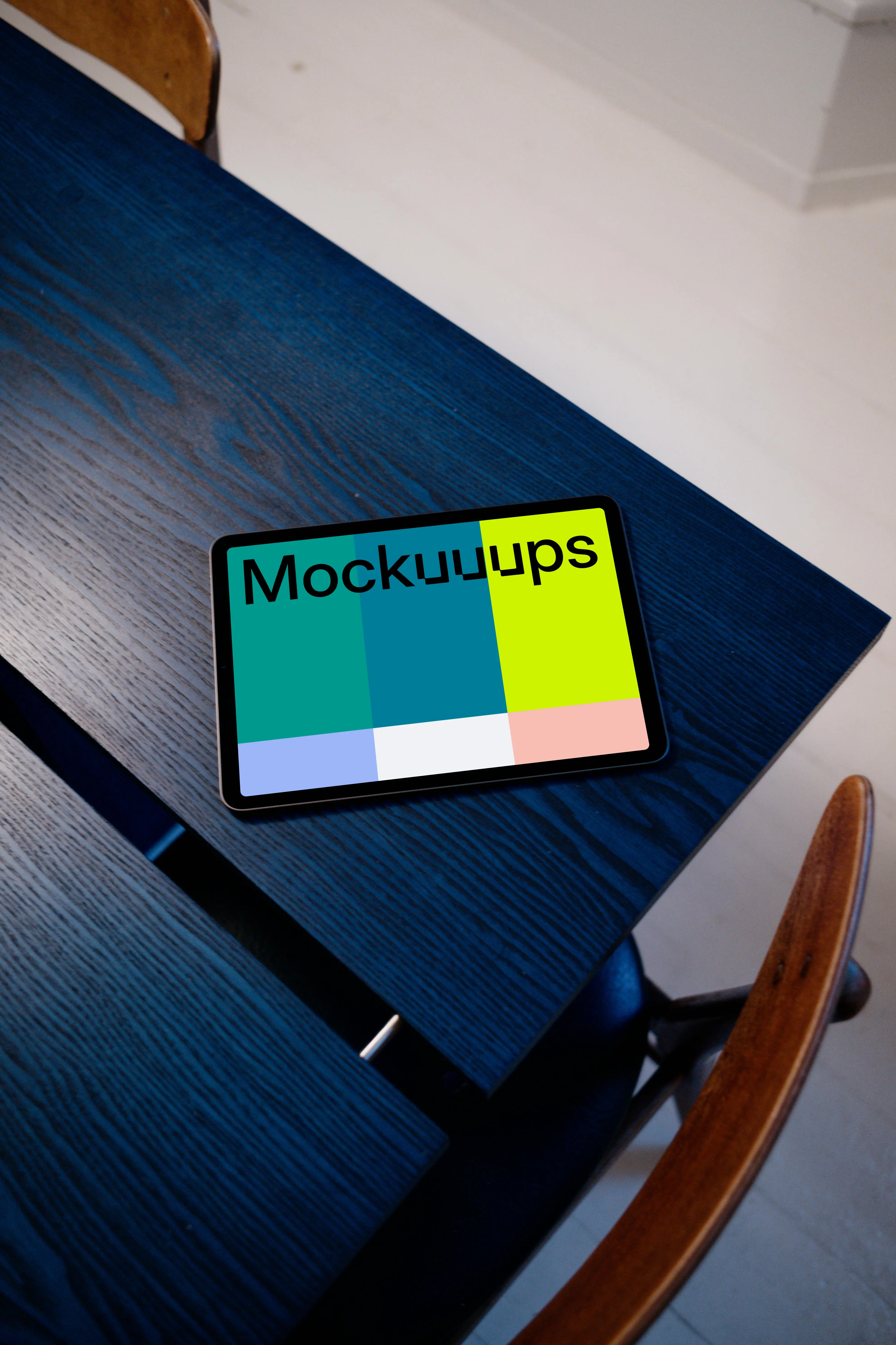 iPad Air mockup on a blue table with a white background