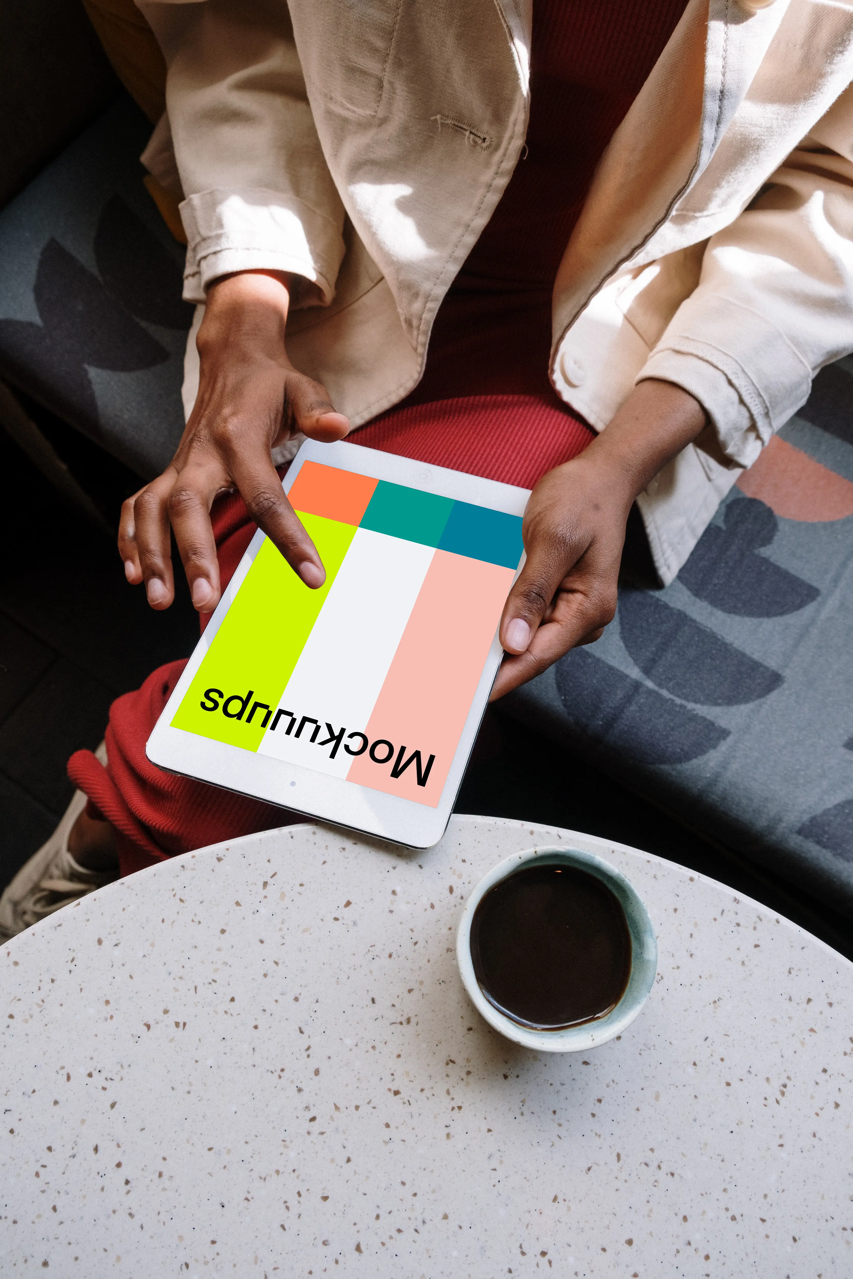 iPad Mini mockup front view in a black ladies hand