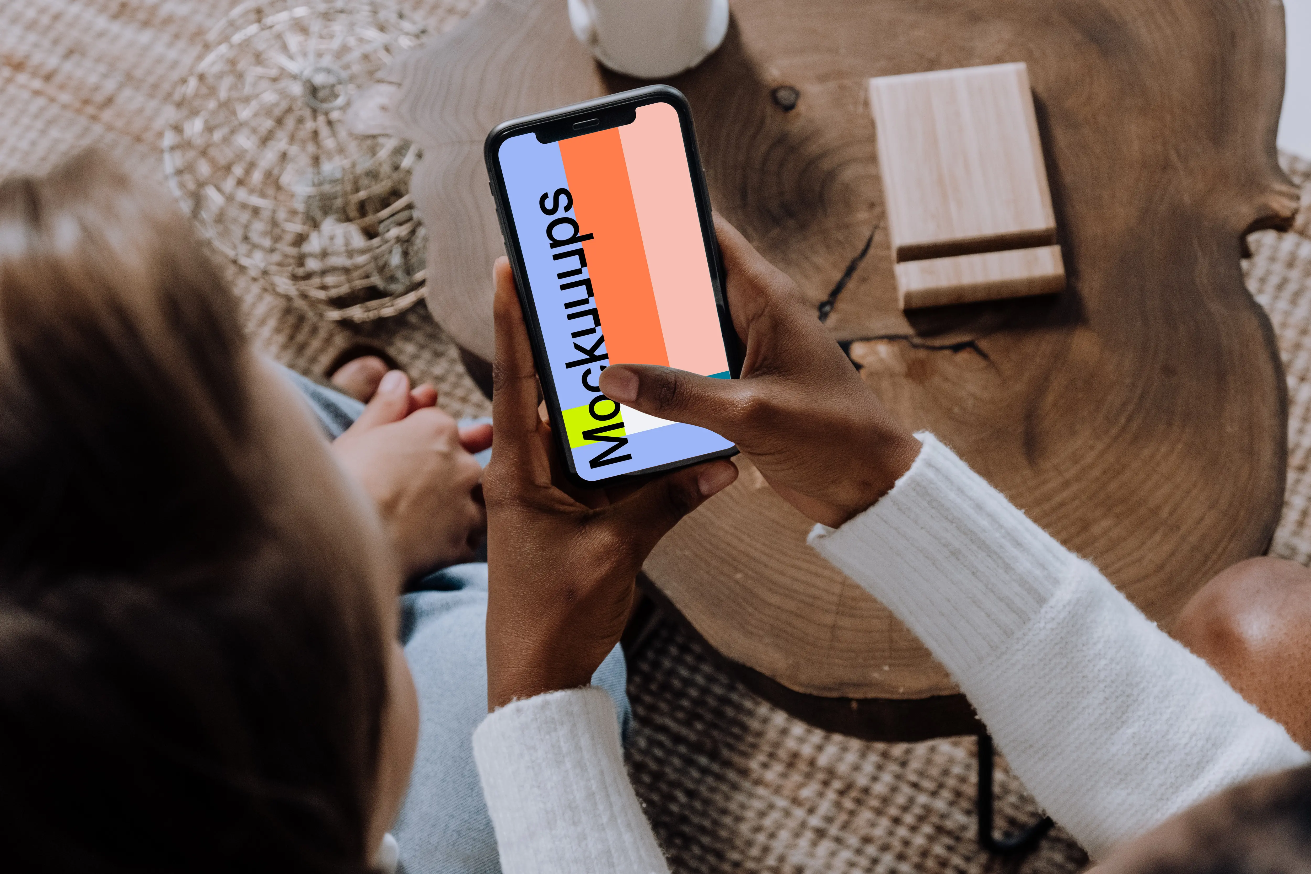 iPhone mockup in a ladies hand beside a friend.