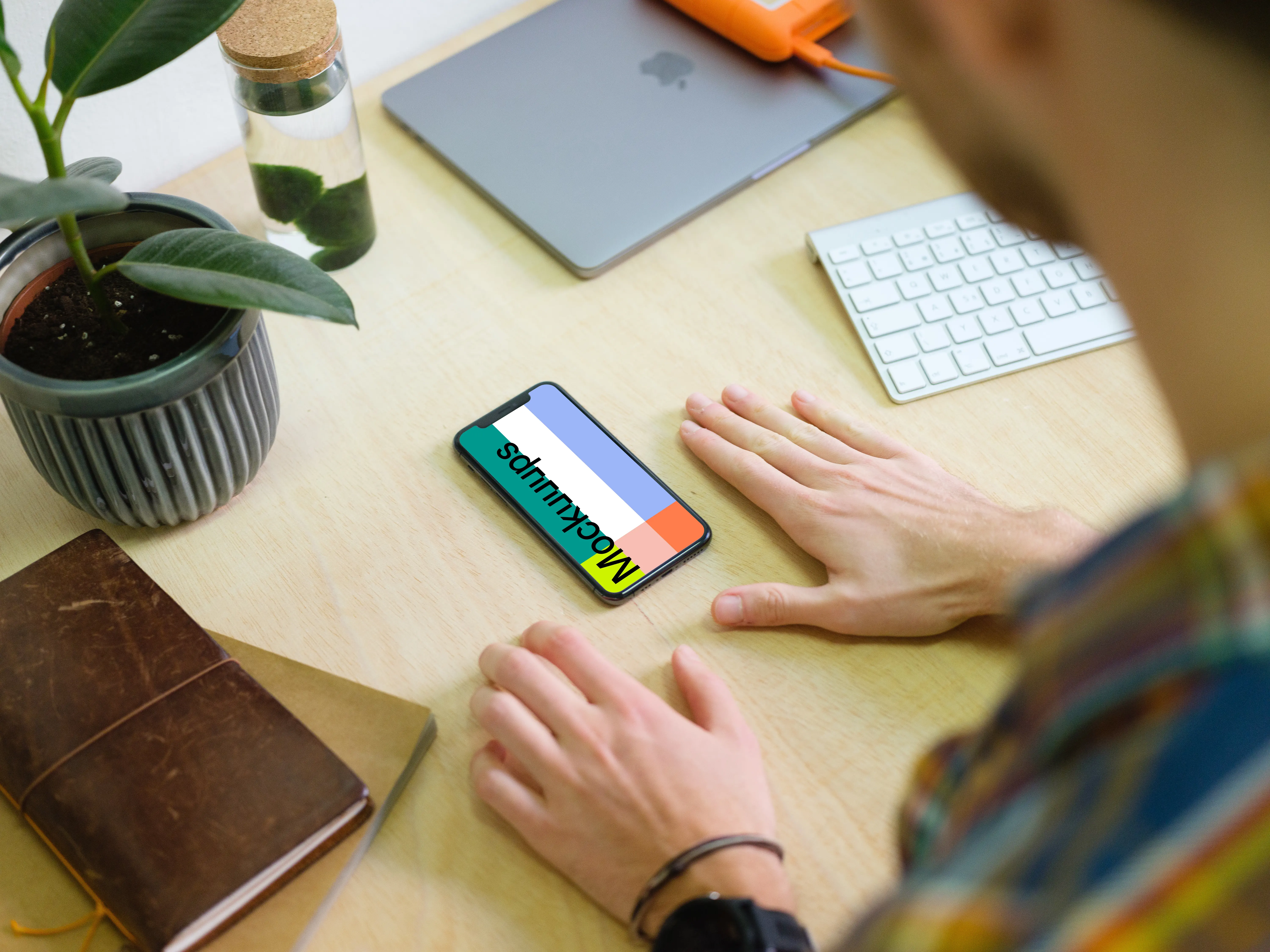 Man with iPhone 11 mockup in the office