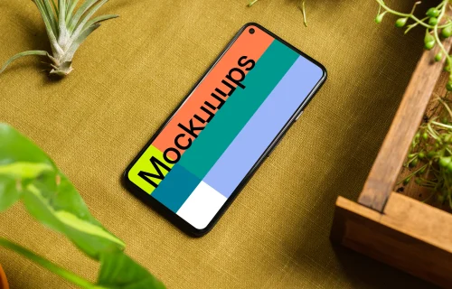 Pixel 5 mockup on a table beside a flower pot