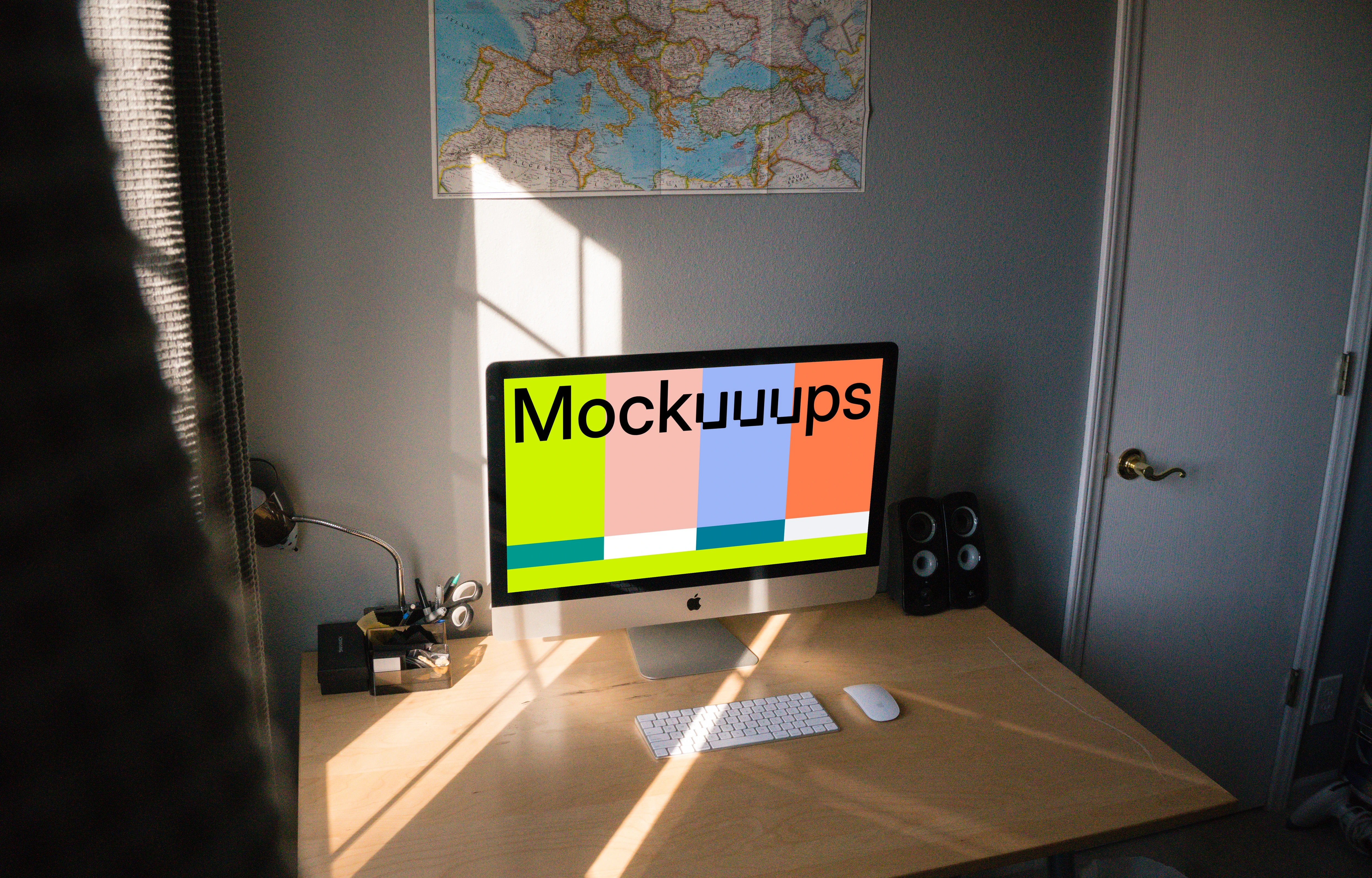 iMac mockup in a room on a table by the window