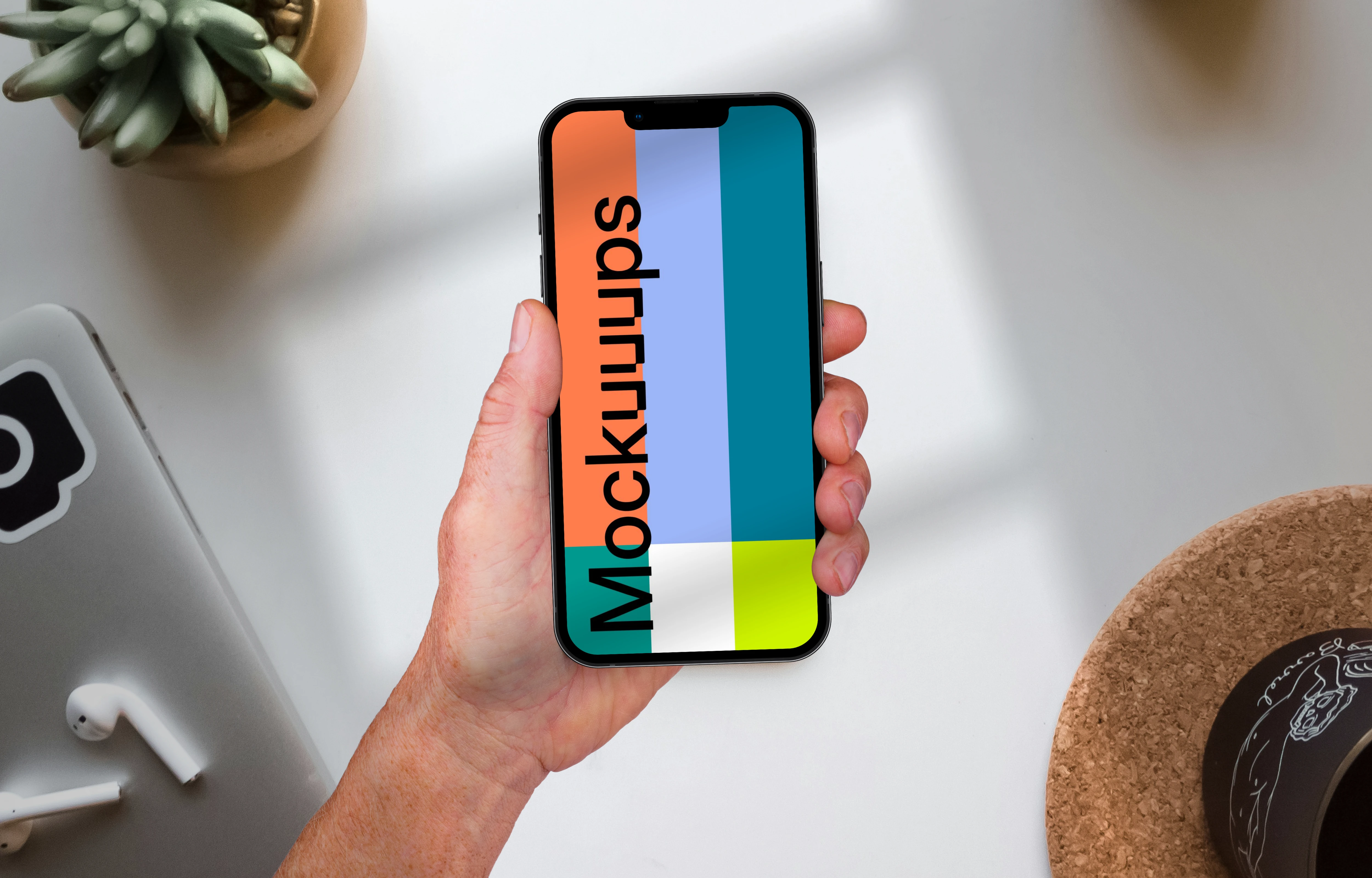 Holding phone mockup on top of the table